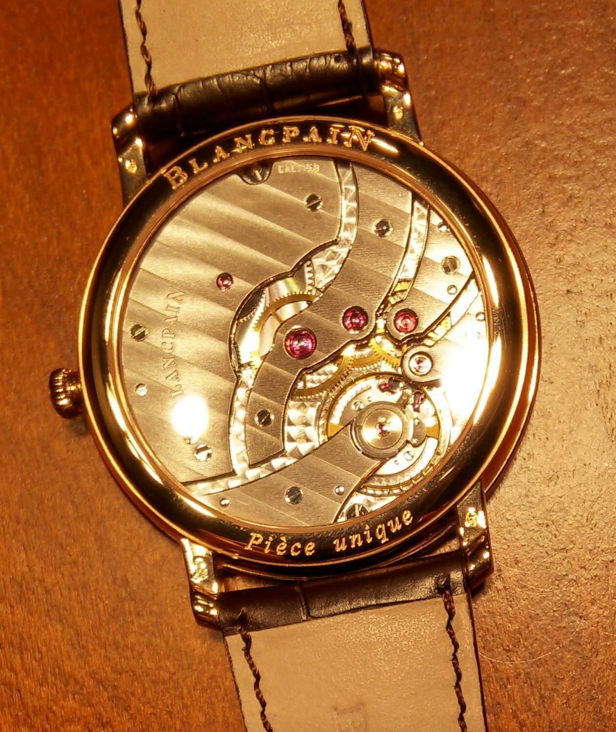 Piece unique caseback view with decorated manual movement