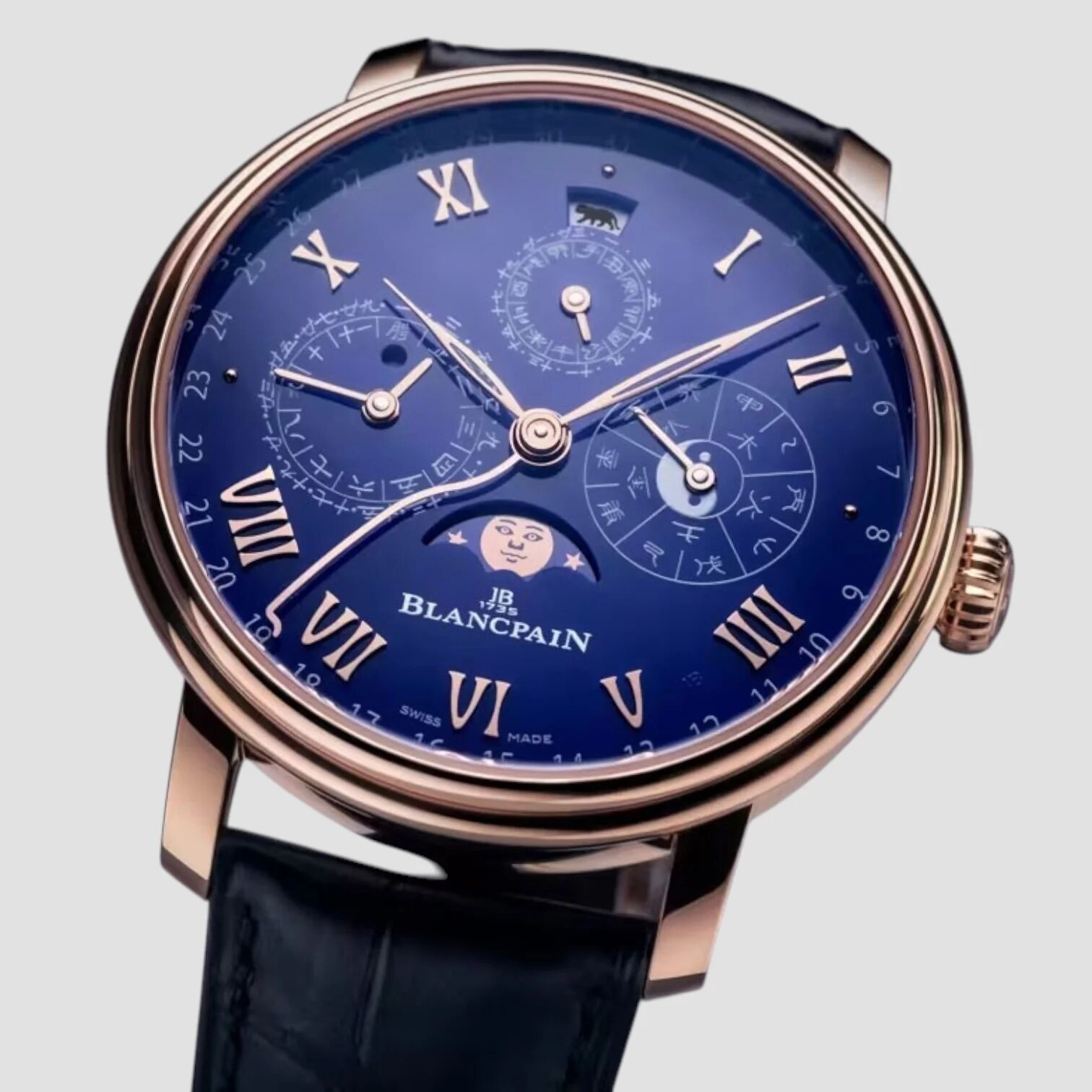 Blue-dial calendar variant in red gold case
