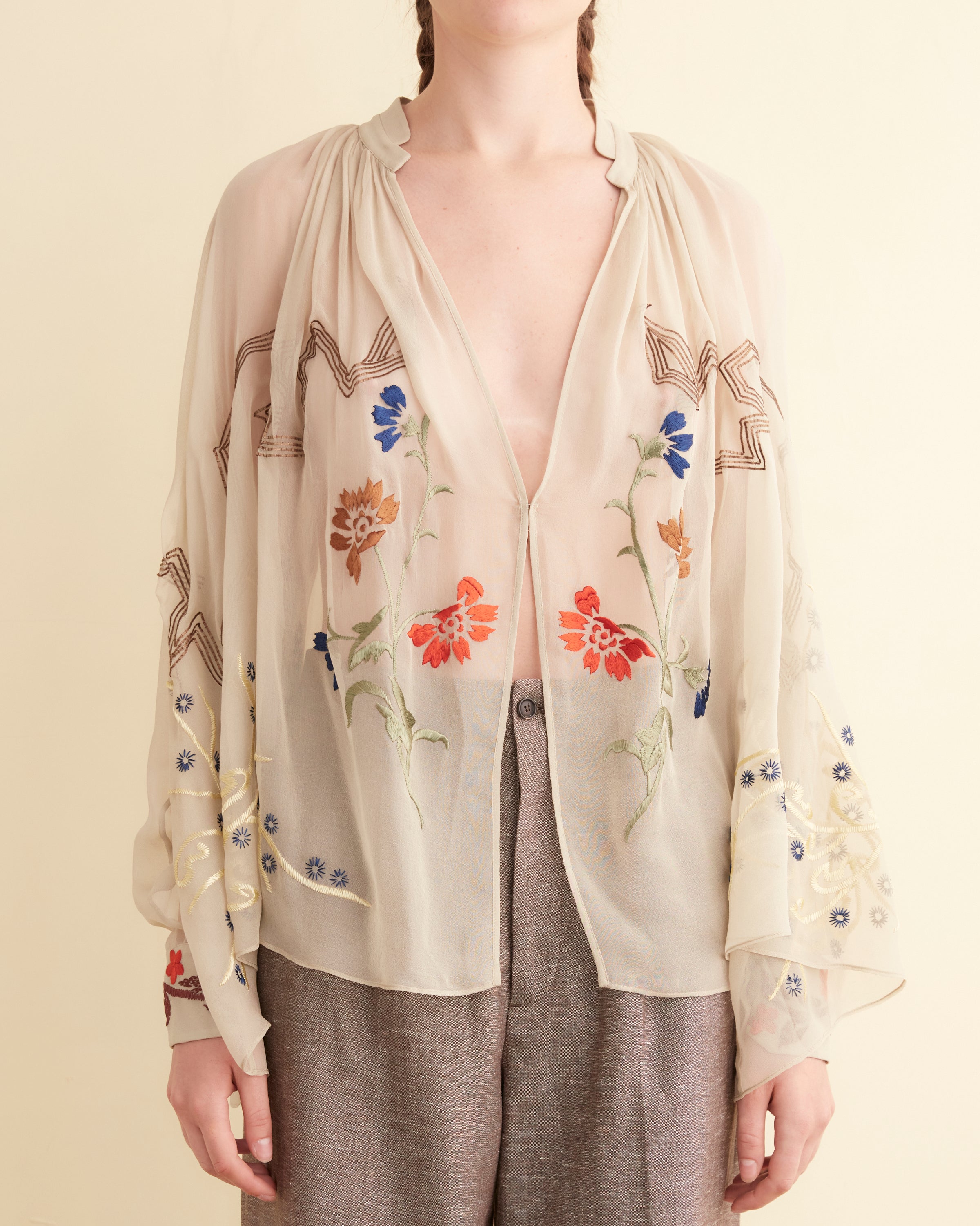 Geometric floral embroidery across the silk body