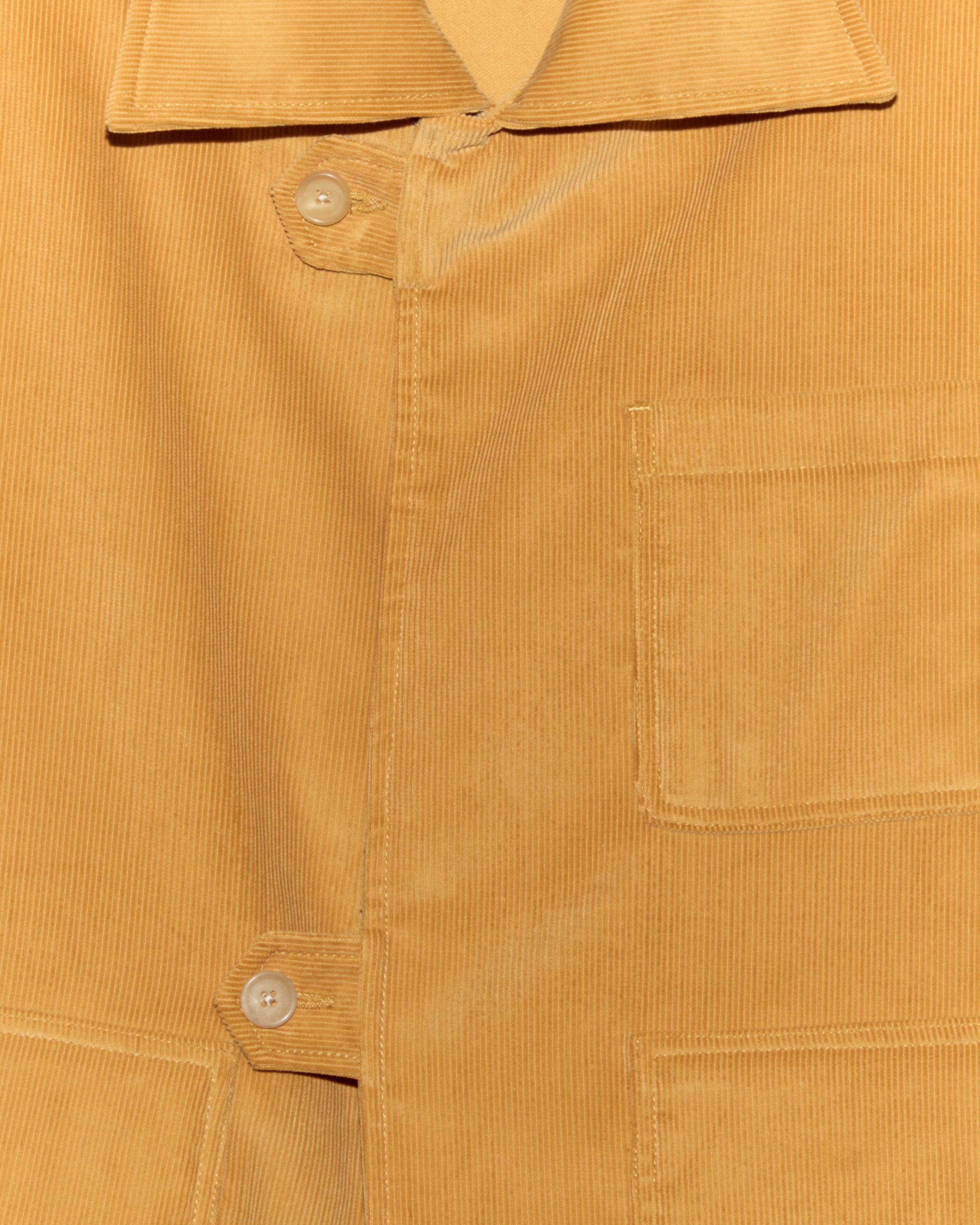 Front-tab jacket with dense personal motifs