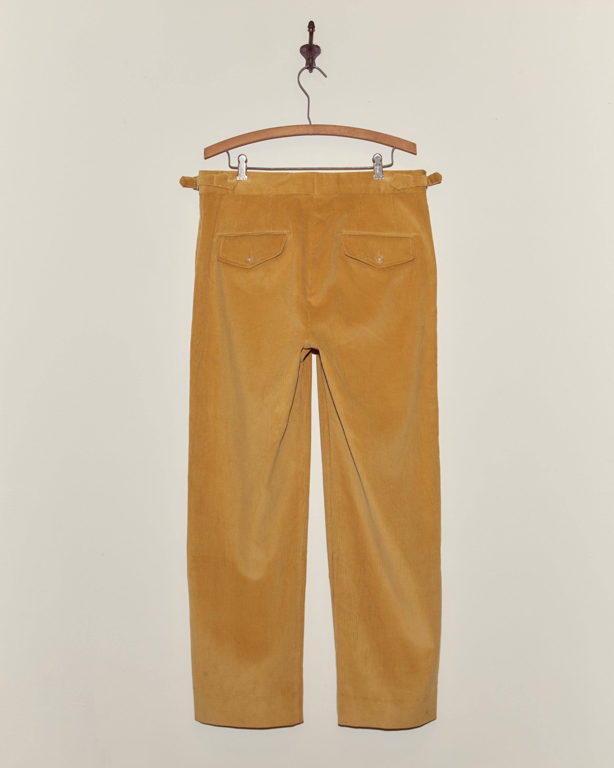 Side-buckle trouser view with hand-drawn motifs