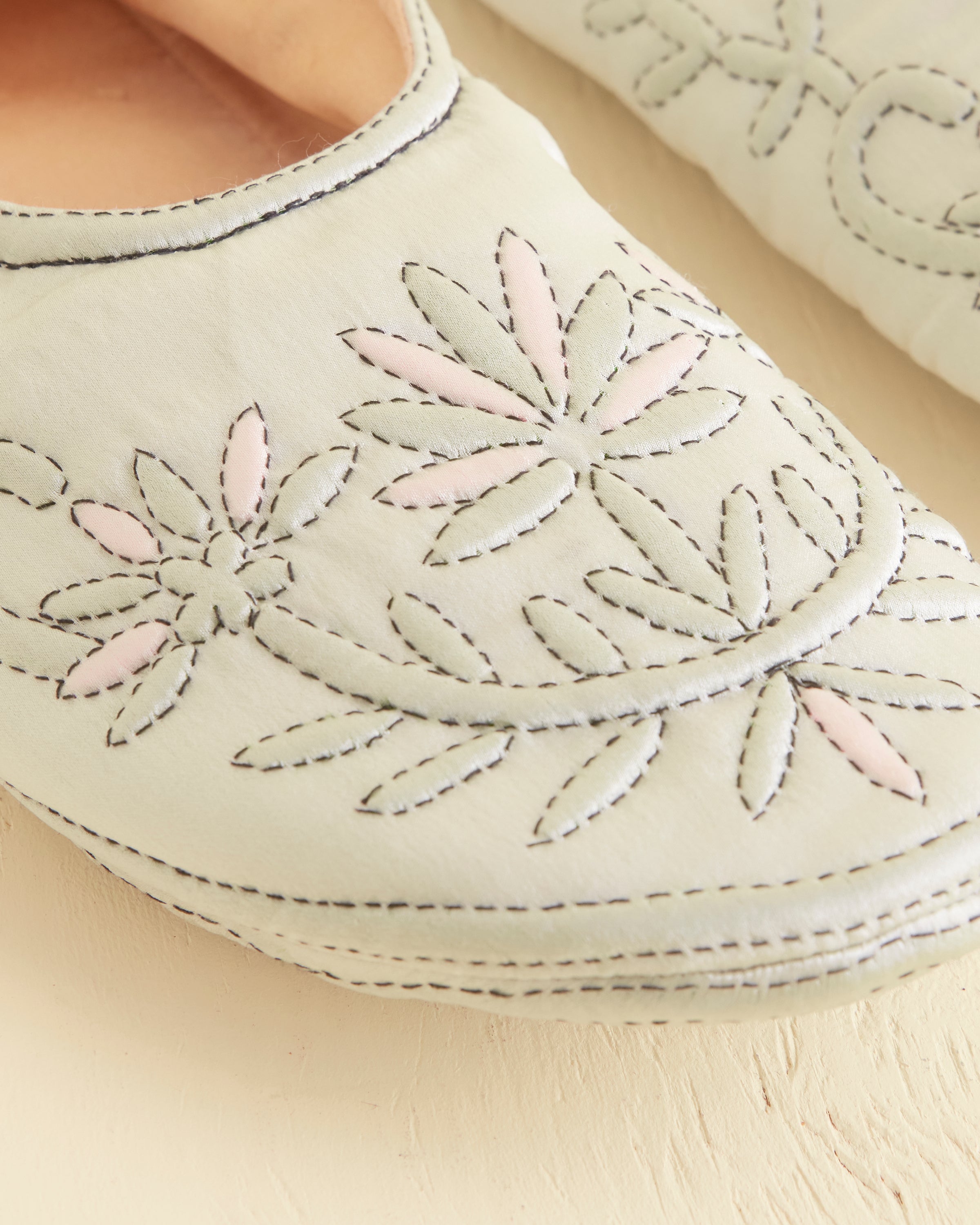 Embroidered floral pattern across the upper