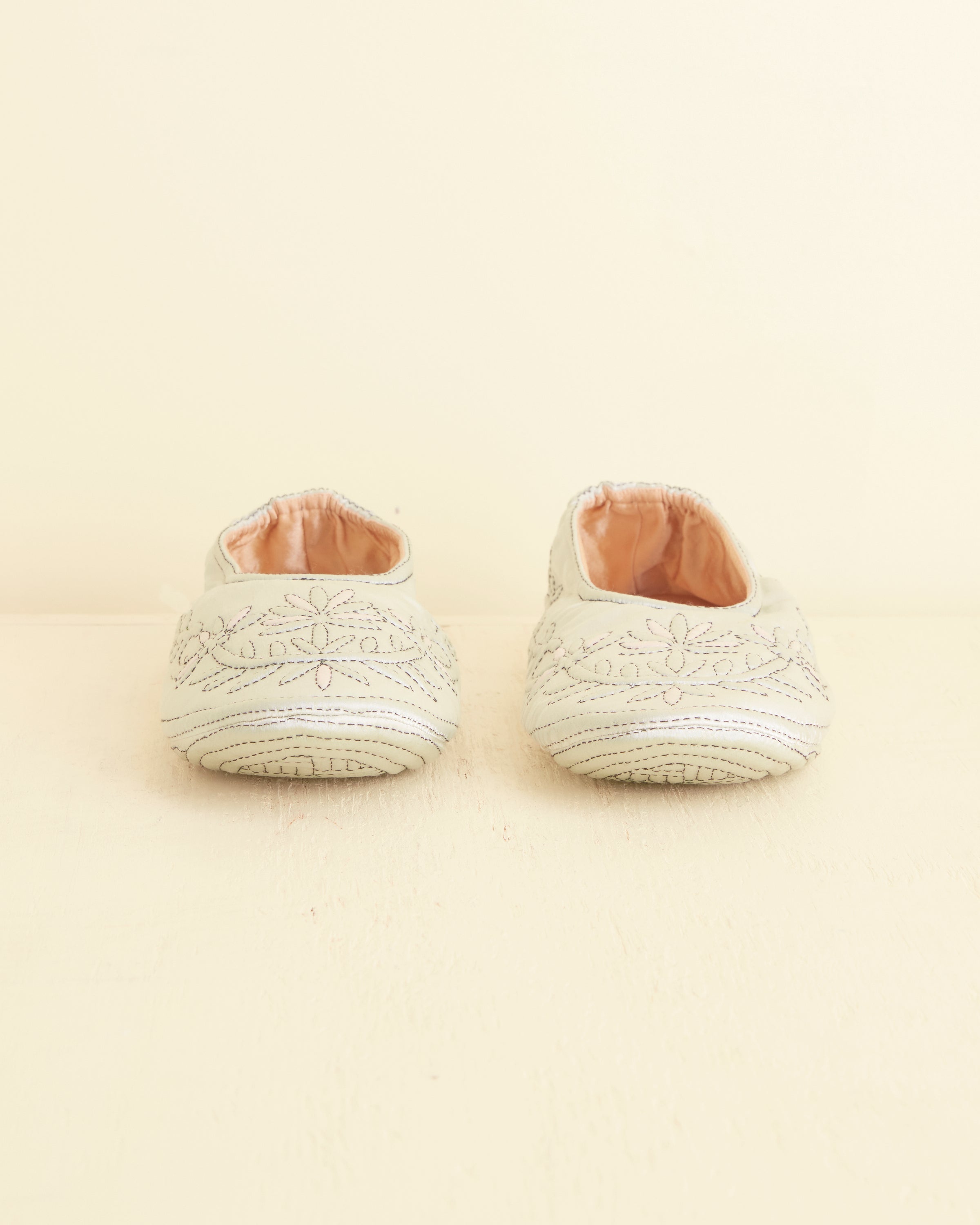 Side view of the handmade silk-slipper shape