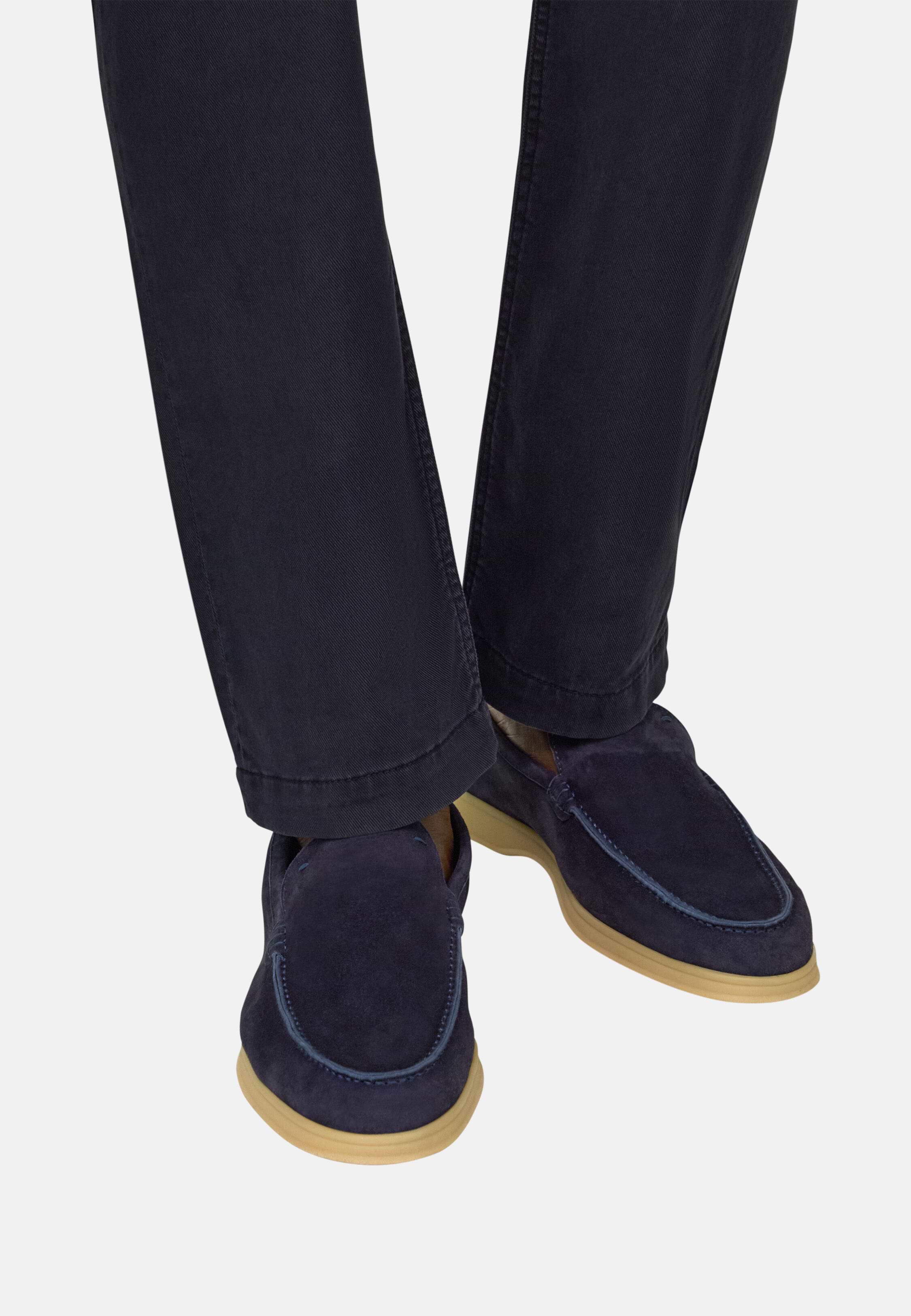 Loafers worn with navy trousers