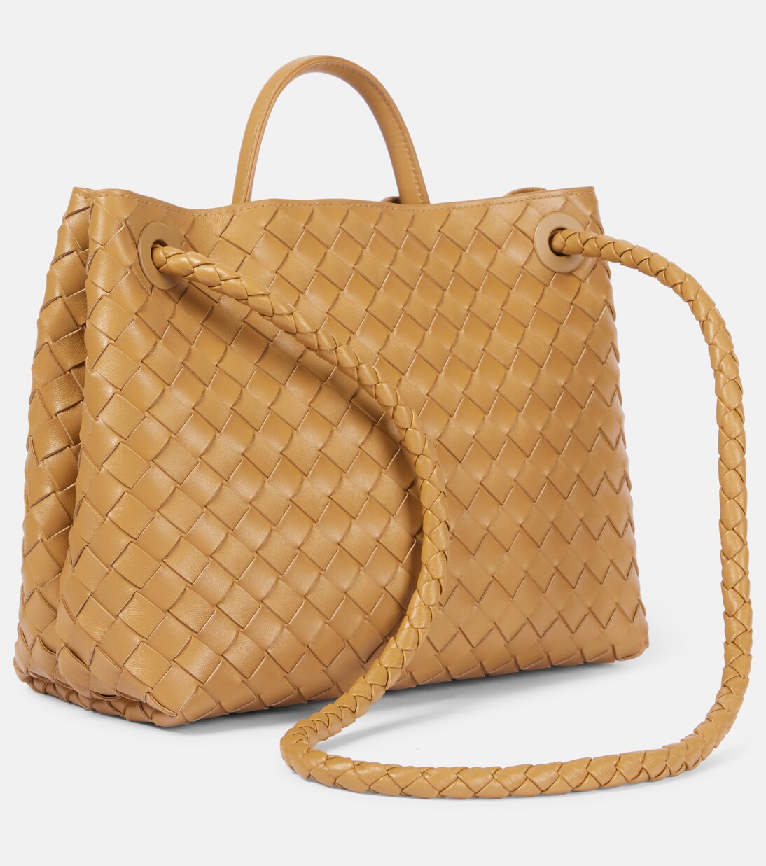 Three-quarter view showing the braided leather shoulder strap