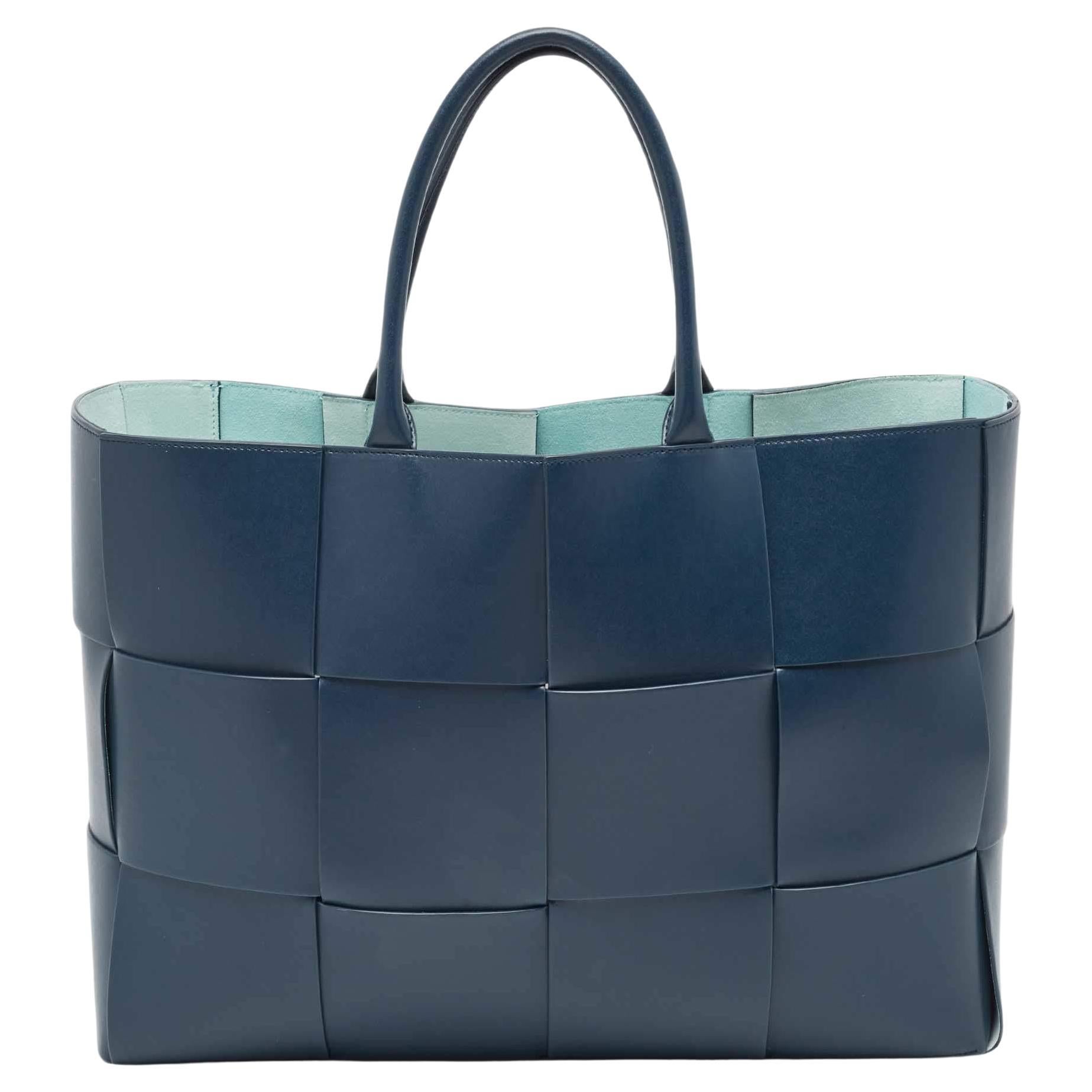 Navy with mint suede interior, showing the open-top structure