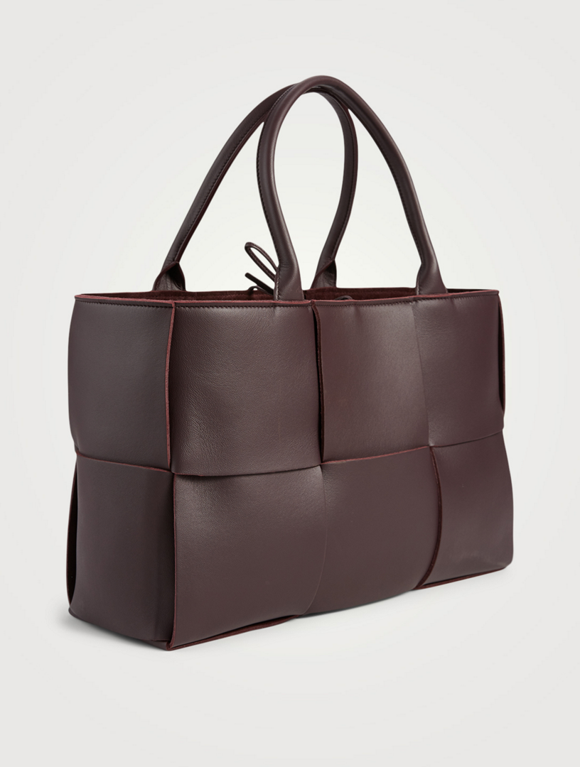 Burgundy three-quarter angle — the woven squares wrapping the corner