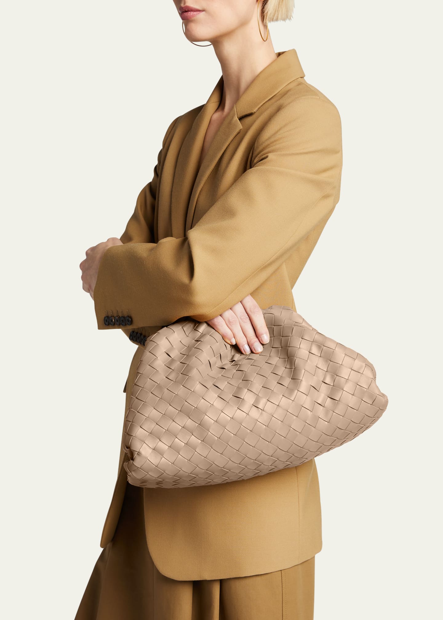 Carried under the arm in nude — the clutch proportion in context
