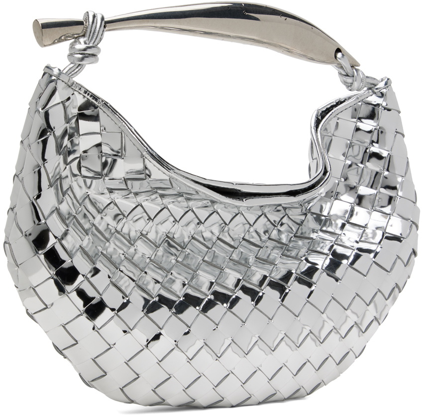 Polished silver three-quarter angle showing the crescent shape