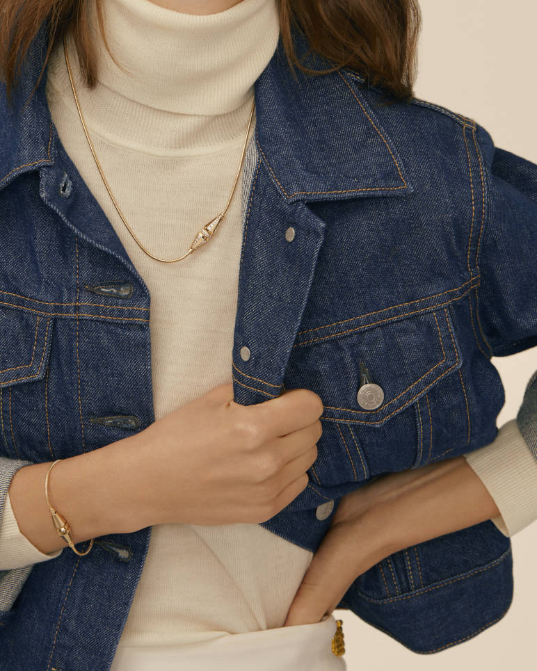 Layered styling with the clasp visible