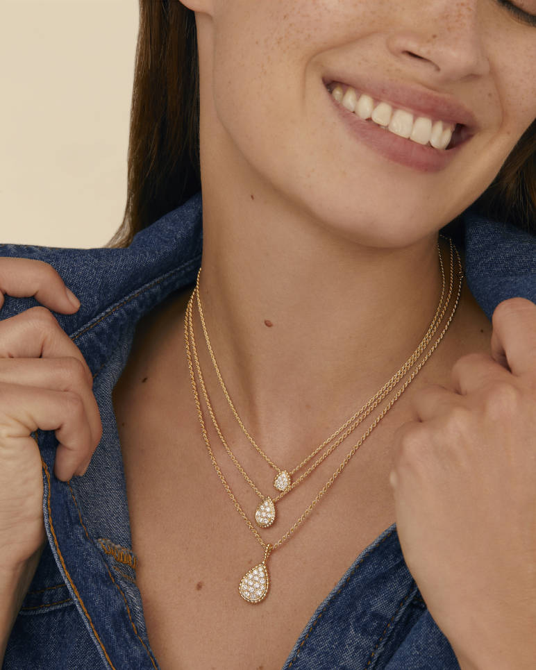 Pendant layered on the neckline