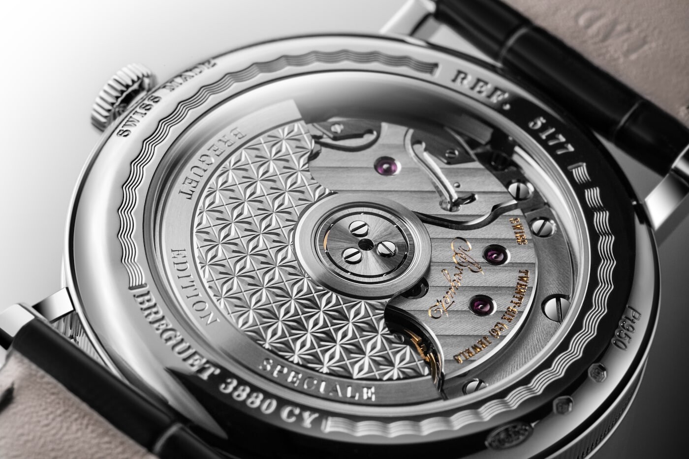 Sapphire caseback and engraved oscillating weight