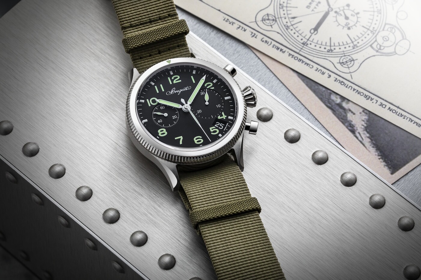 Low side view of the chronograph pushers and fluted bezel