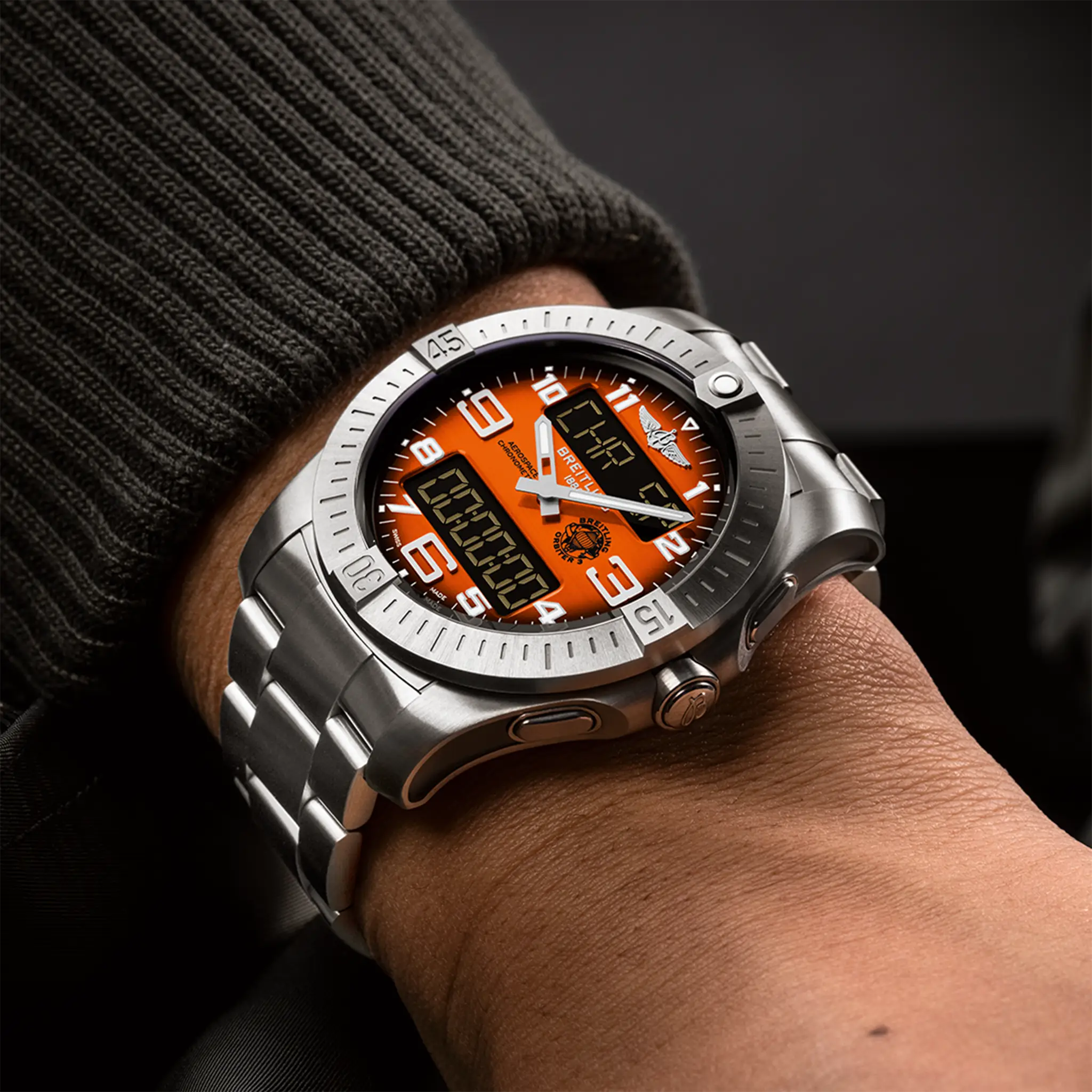On-wrist view of the orange-dial Aerospace B70