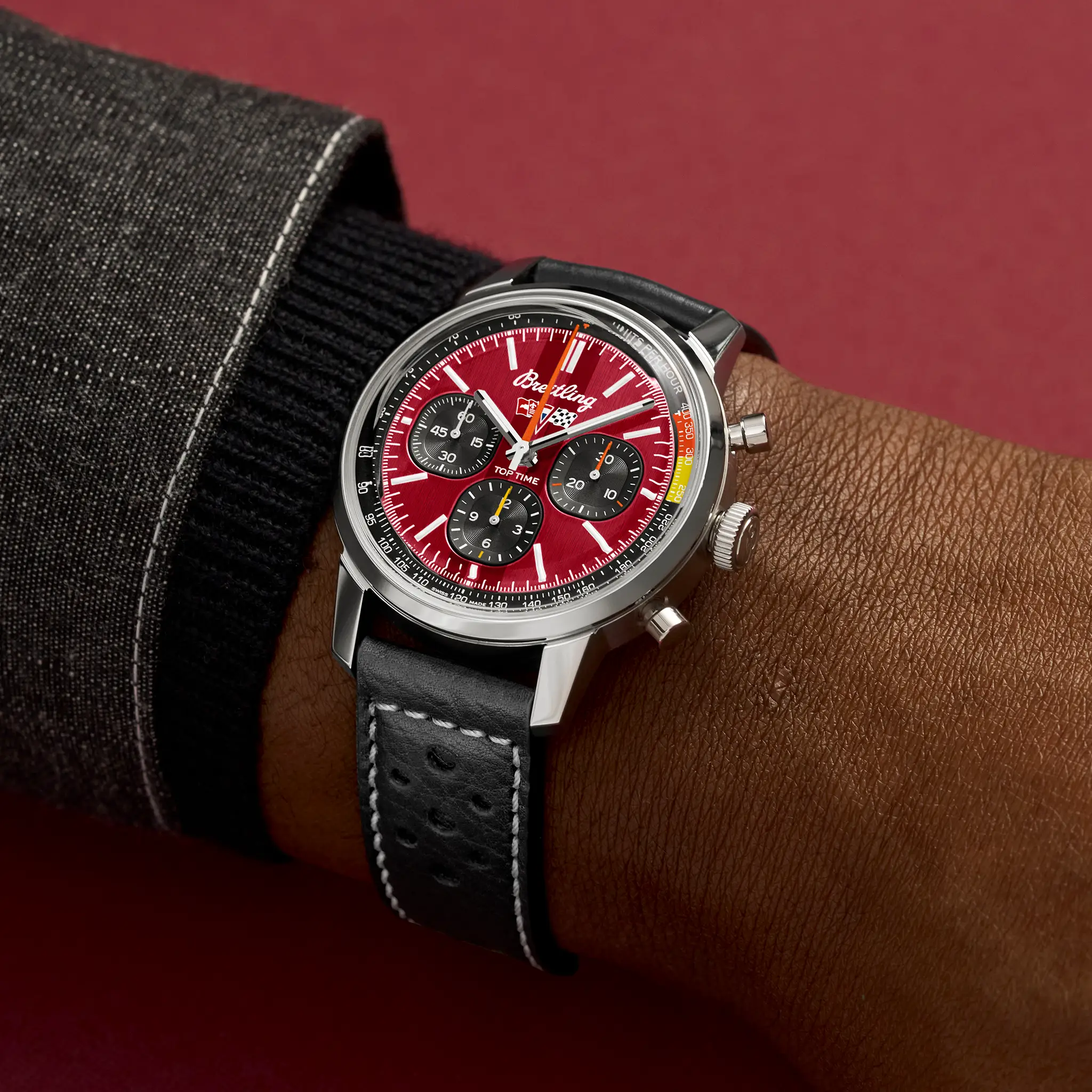 On-wrist view of the red-dial Top Time