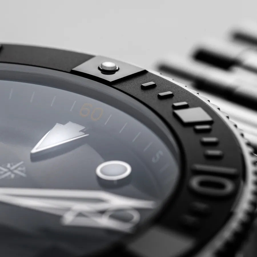 Bezel and domed sapphire crystal detail