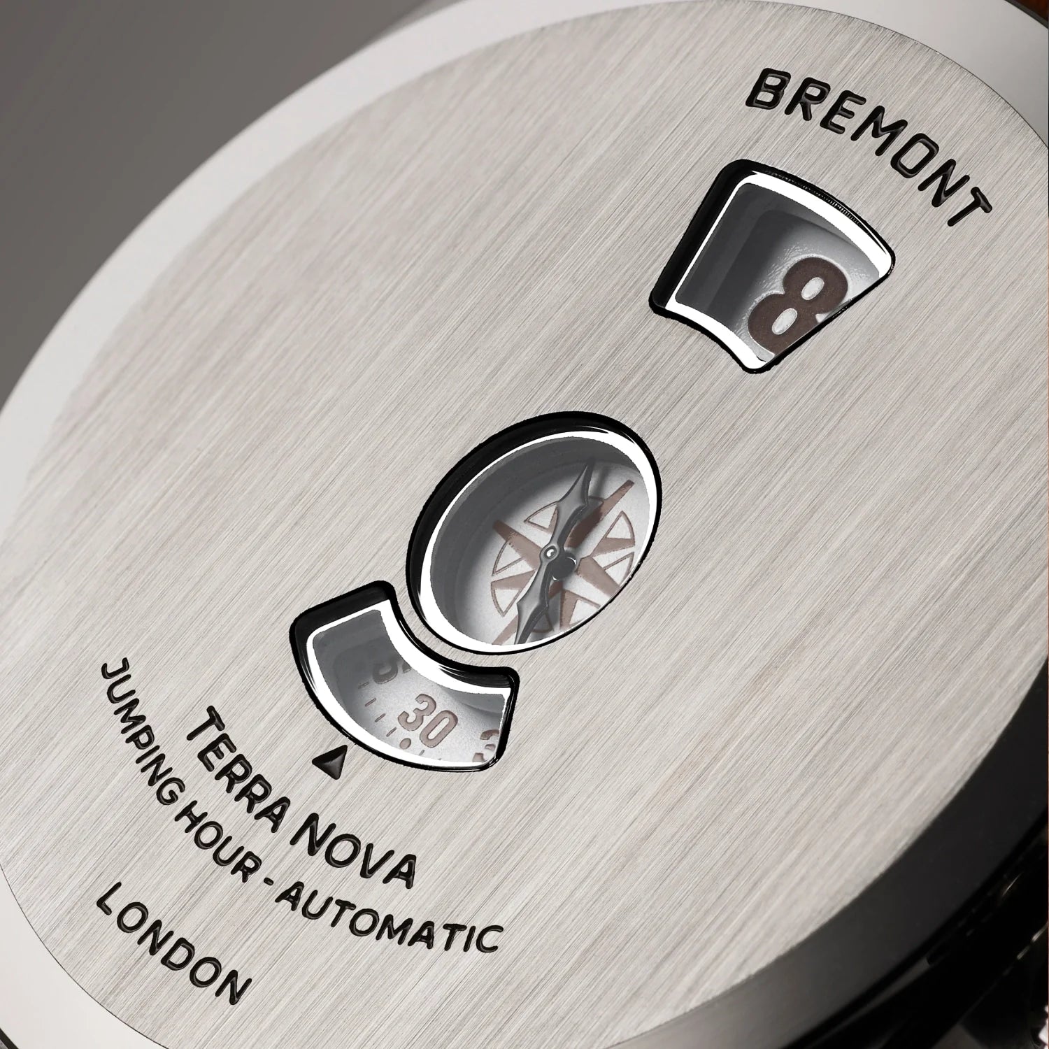 Closeup of the jumping-hour apertures and brushed caseback