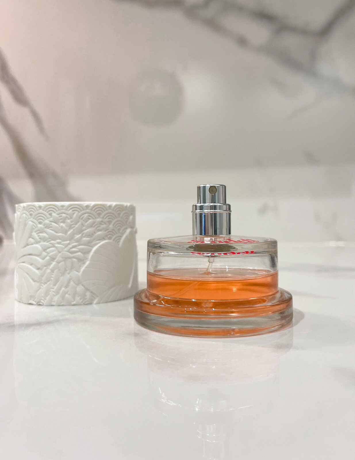 clear bottle with white textured cap