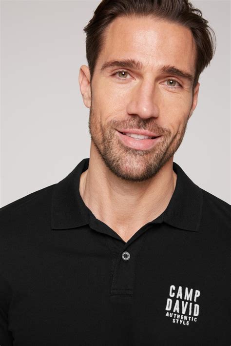 black polo, chest embroidery