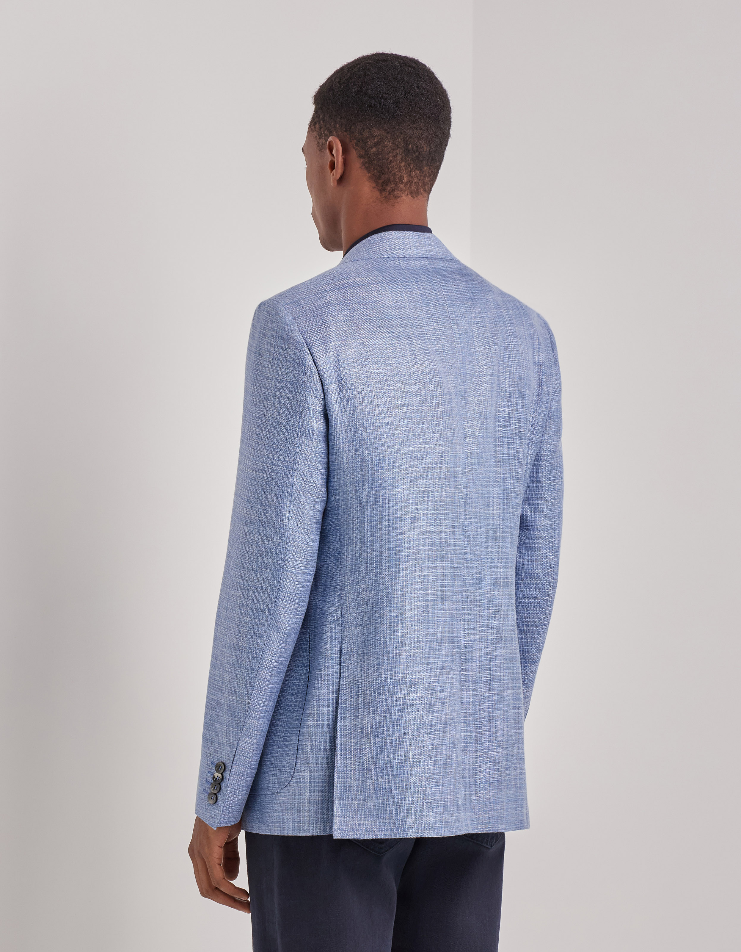 Close crop of lapel, patch pocket and weave