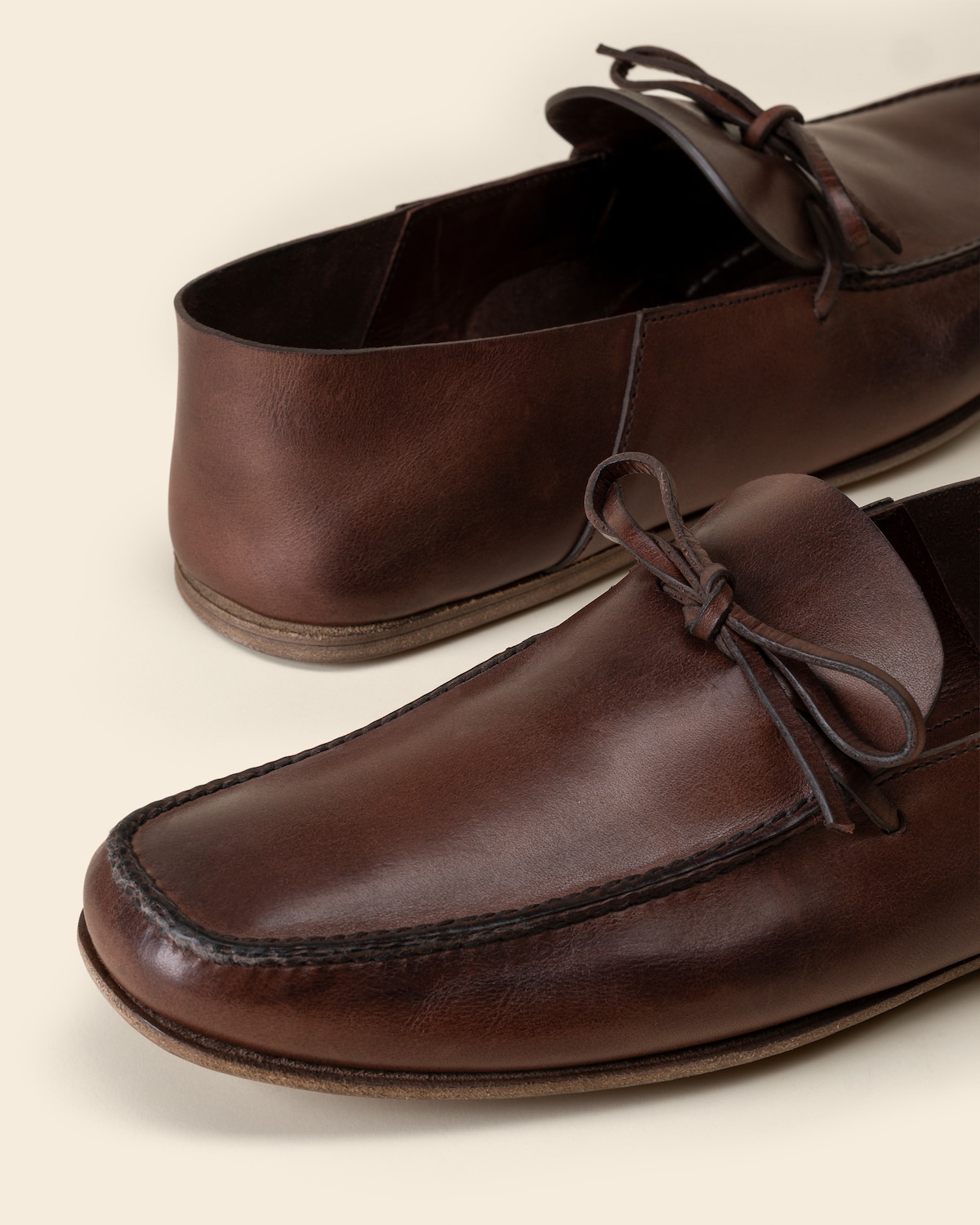 Closeup of the antiqued calfskin and bow