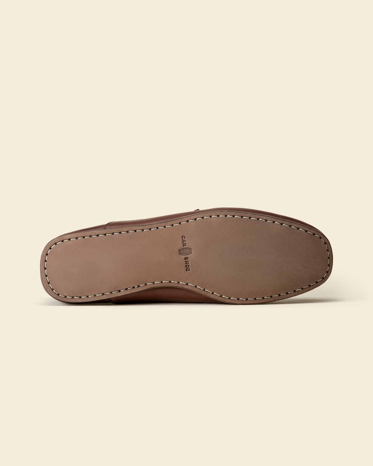 Leather sole with stitched edge
