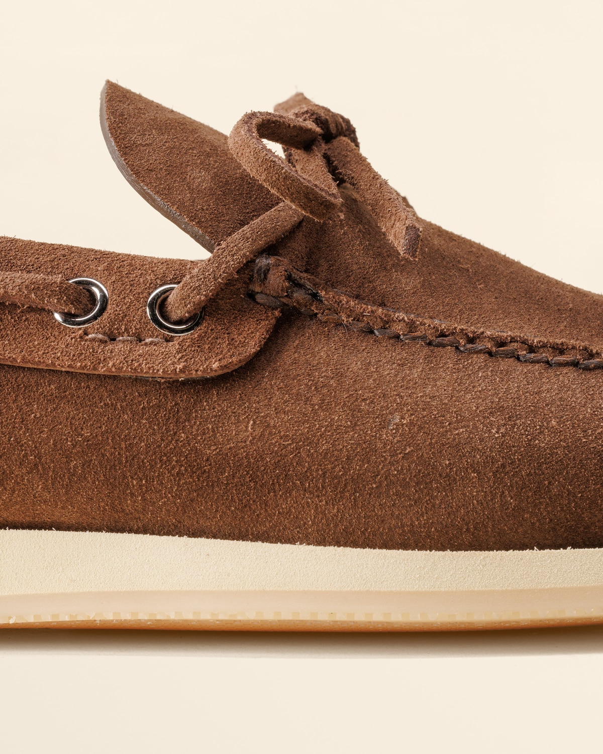 Closeup of beaver-effect suede texture and apron seam