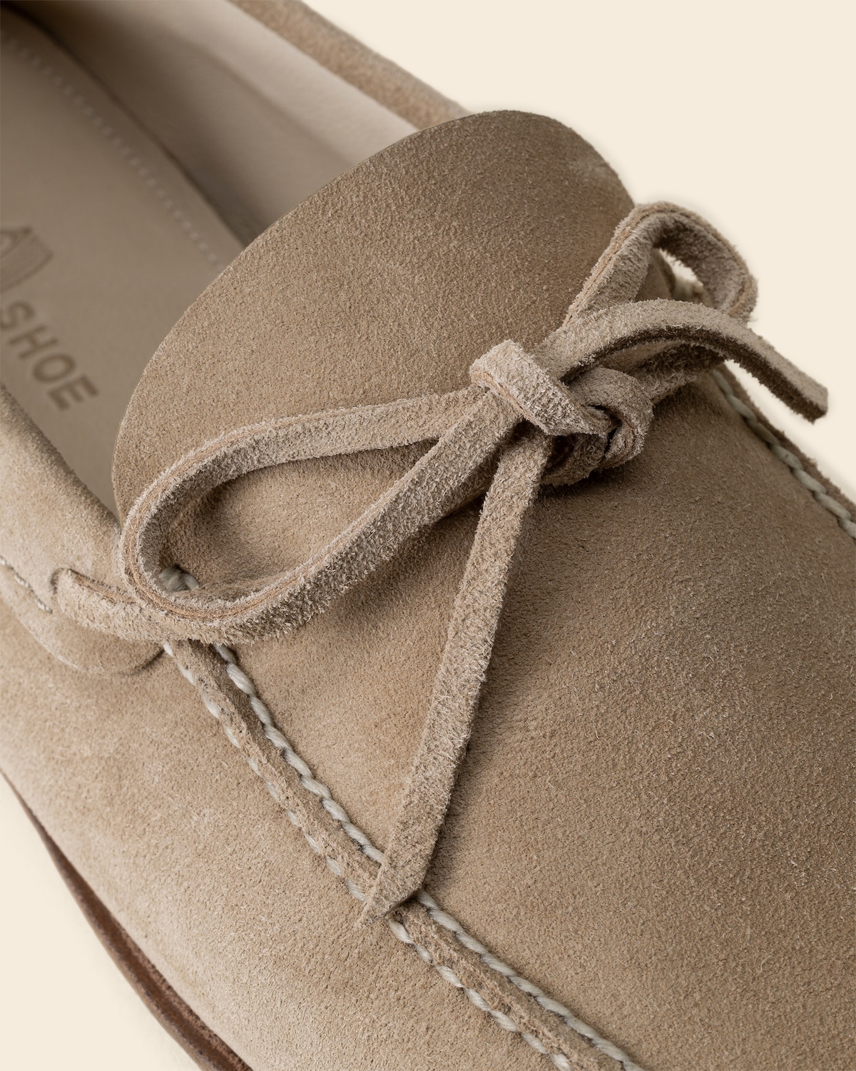 Closeup of the bow, eyelet, and apron-toe seam