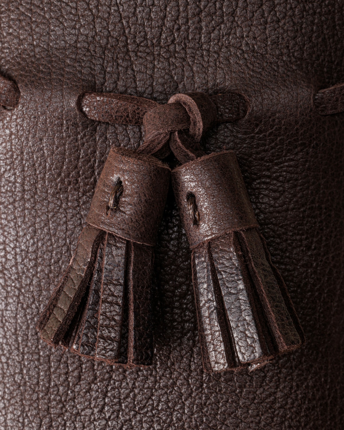 Tassel and grain detail across the vamp