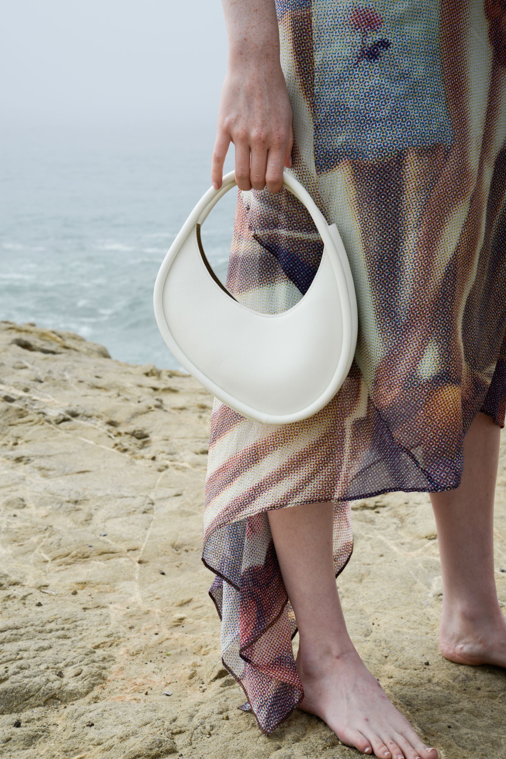 styled white leather bag