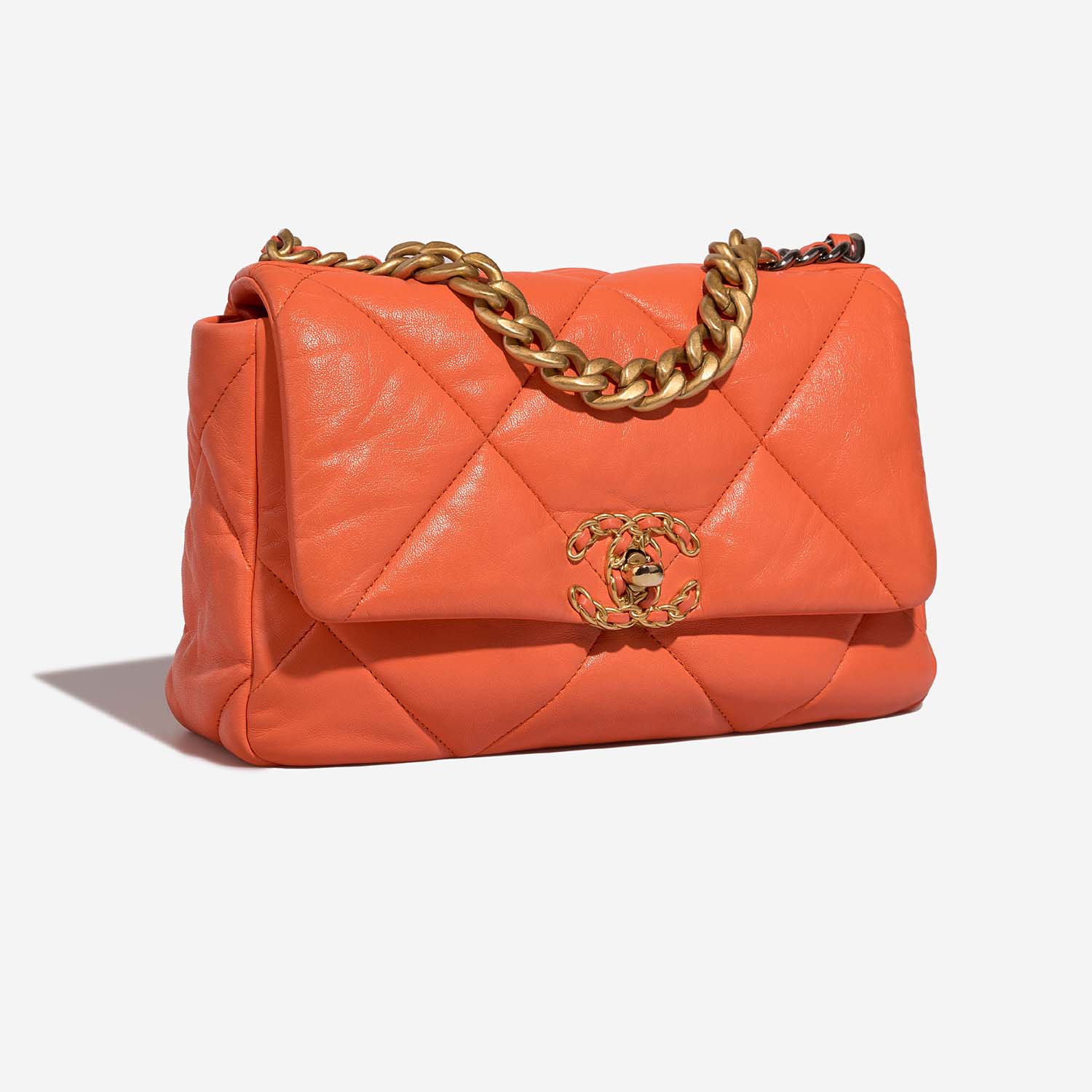 Orange, three-quarter view — the soft puffy quilting