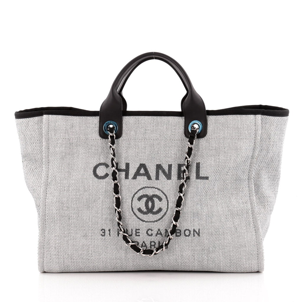 Grey canvas with black leather trim and chain straps