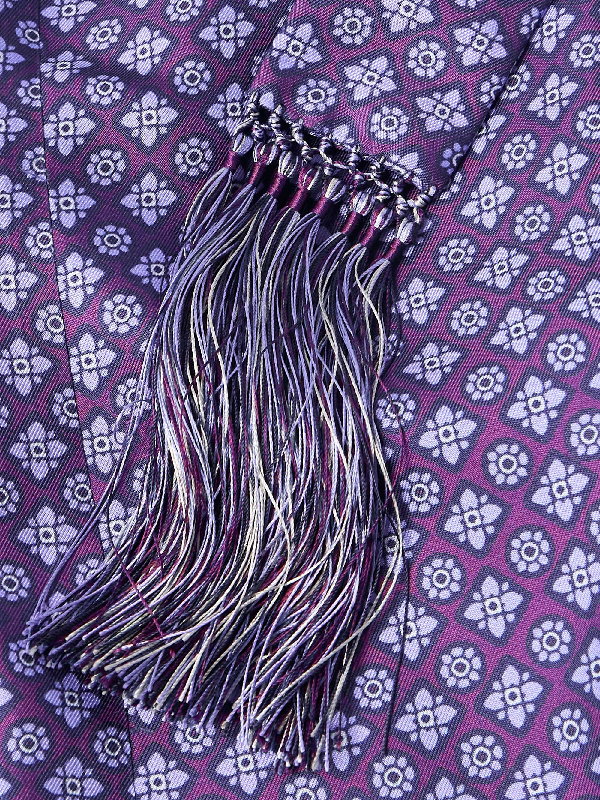 tasselled belt and silk pattern detail