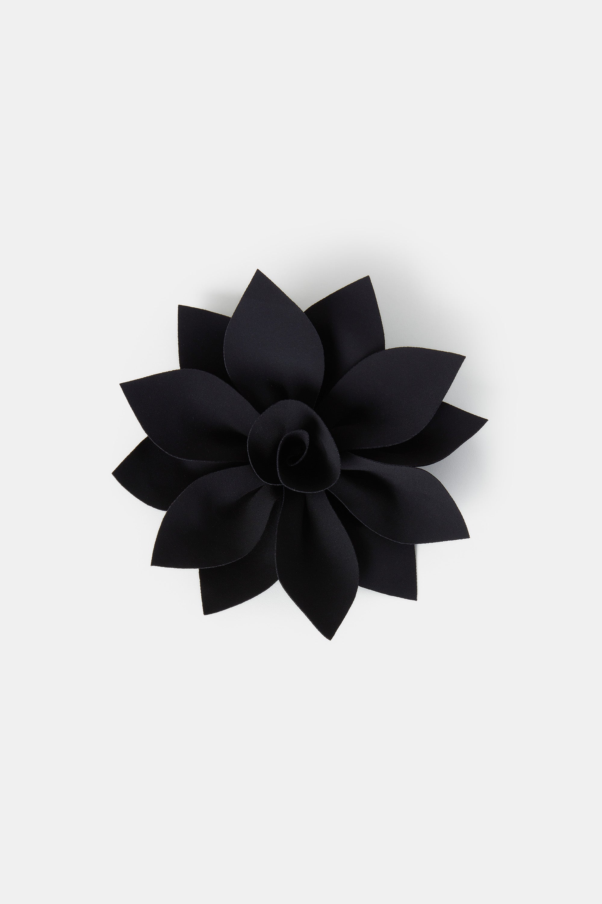black brooch on garment