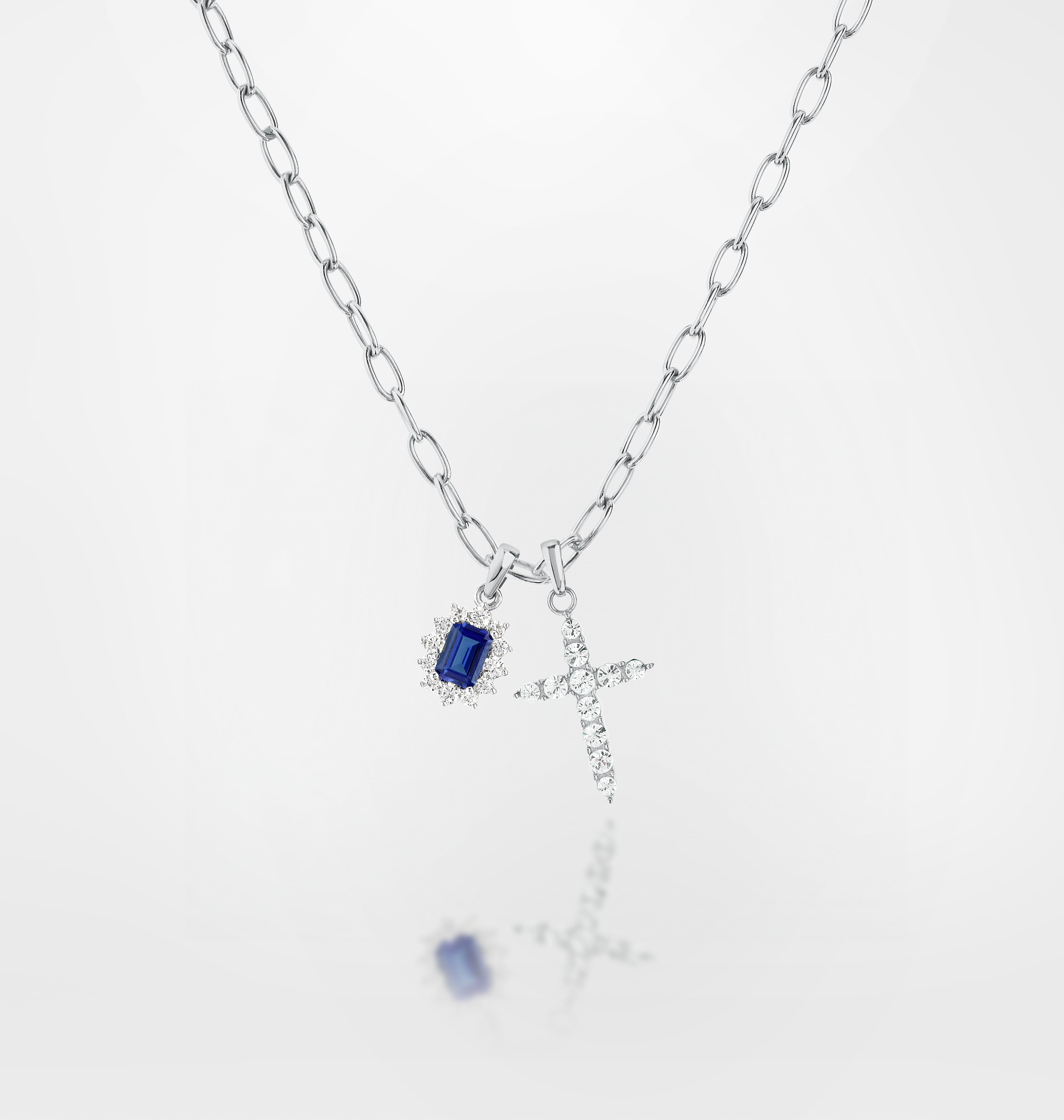 Silver-tone version with blue stone and cross