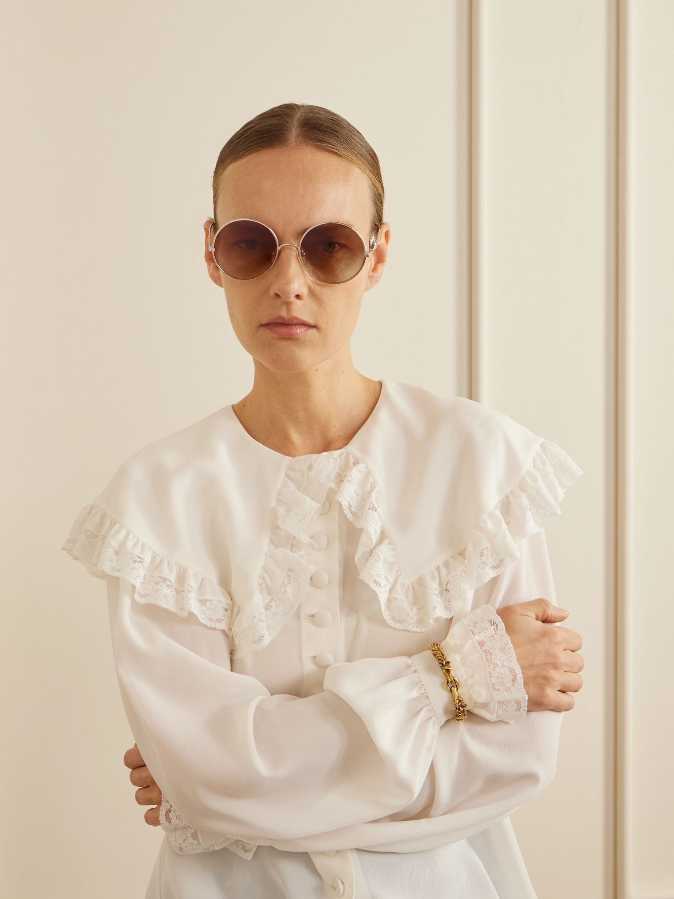 Worn, with a ruffled lace-collared Chloé blouse