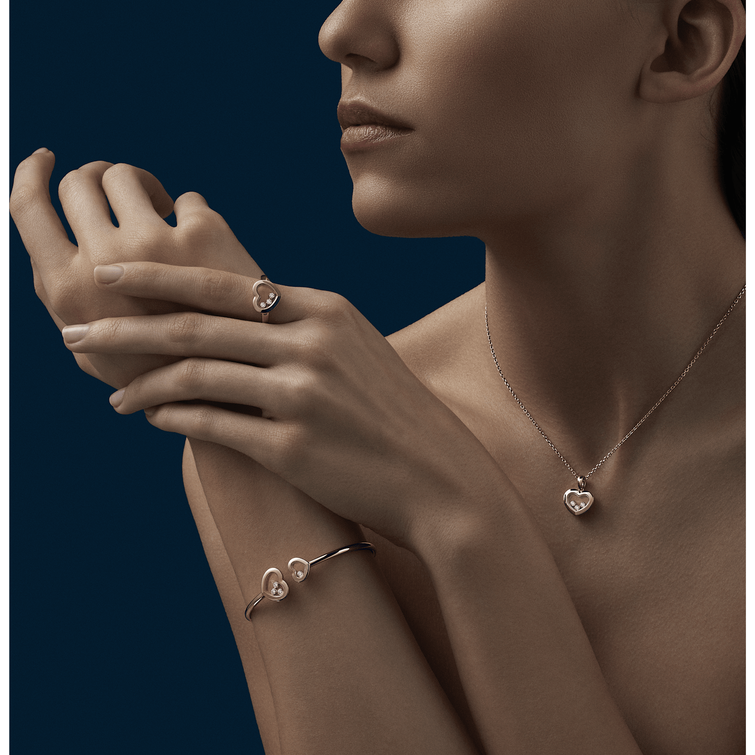 Worn view with the pendant layered at the neckline