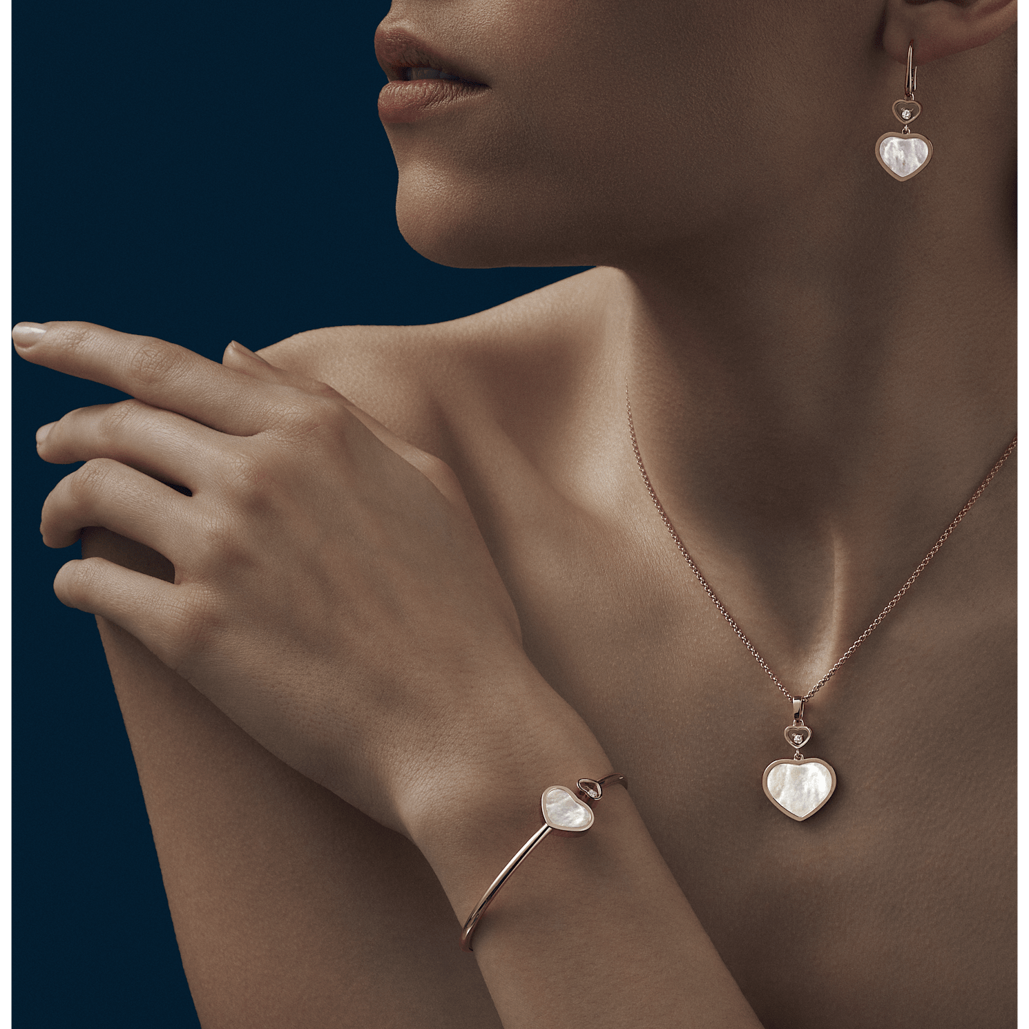 Worn view with Happy Hearts jewellery stacked