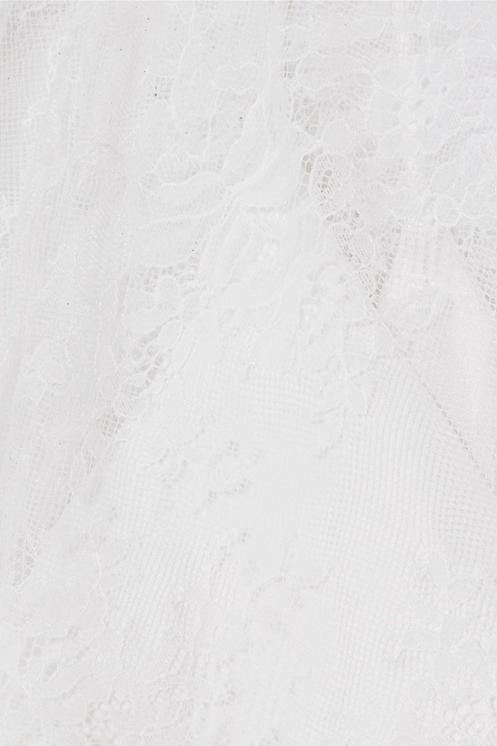 Close detail of scalloped eyelash lace trim at sleeve and hem