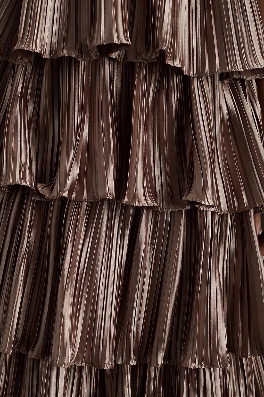Side detail showing the waist-baring cutout construction