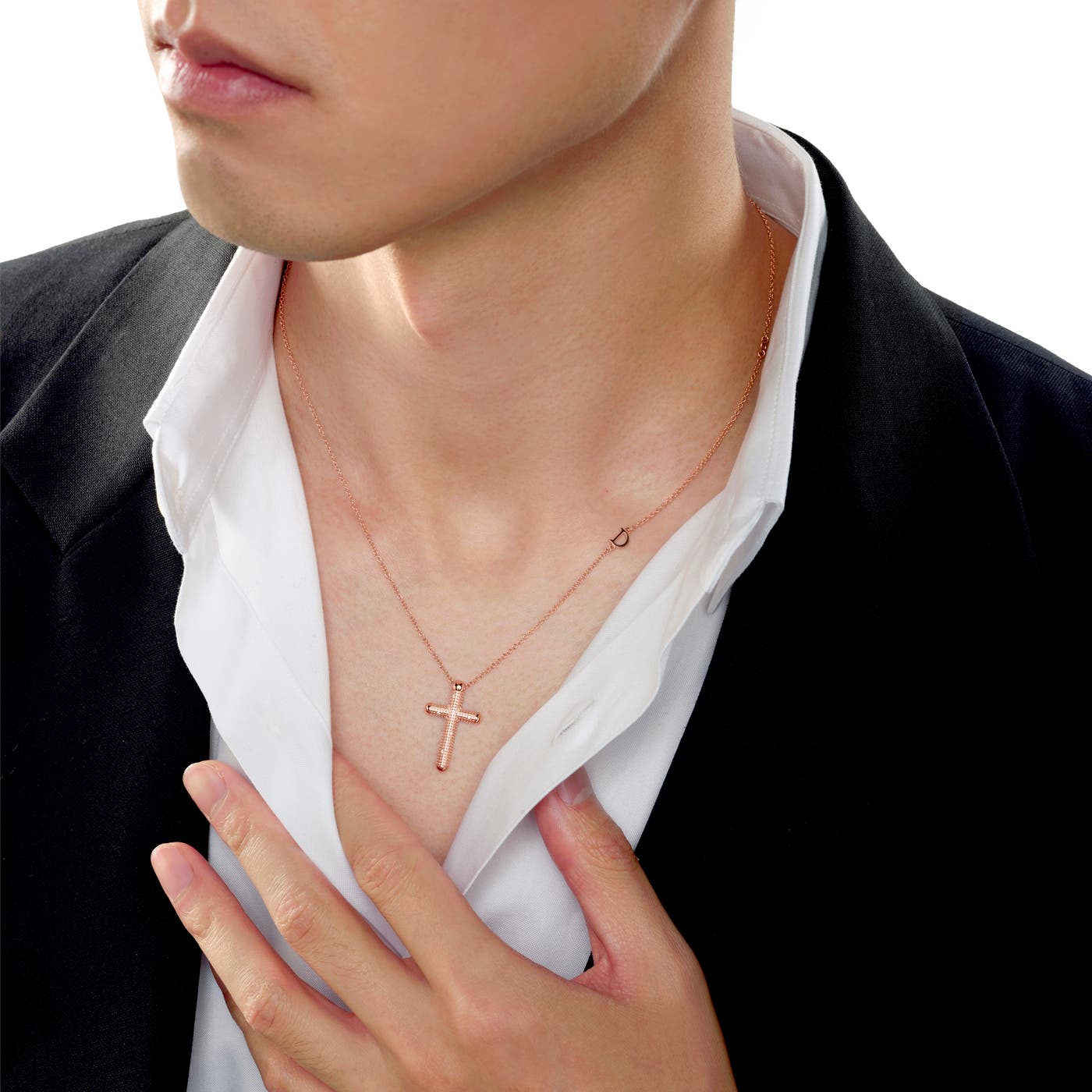 Cross pendant scaled on a shirt collar