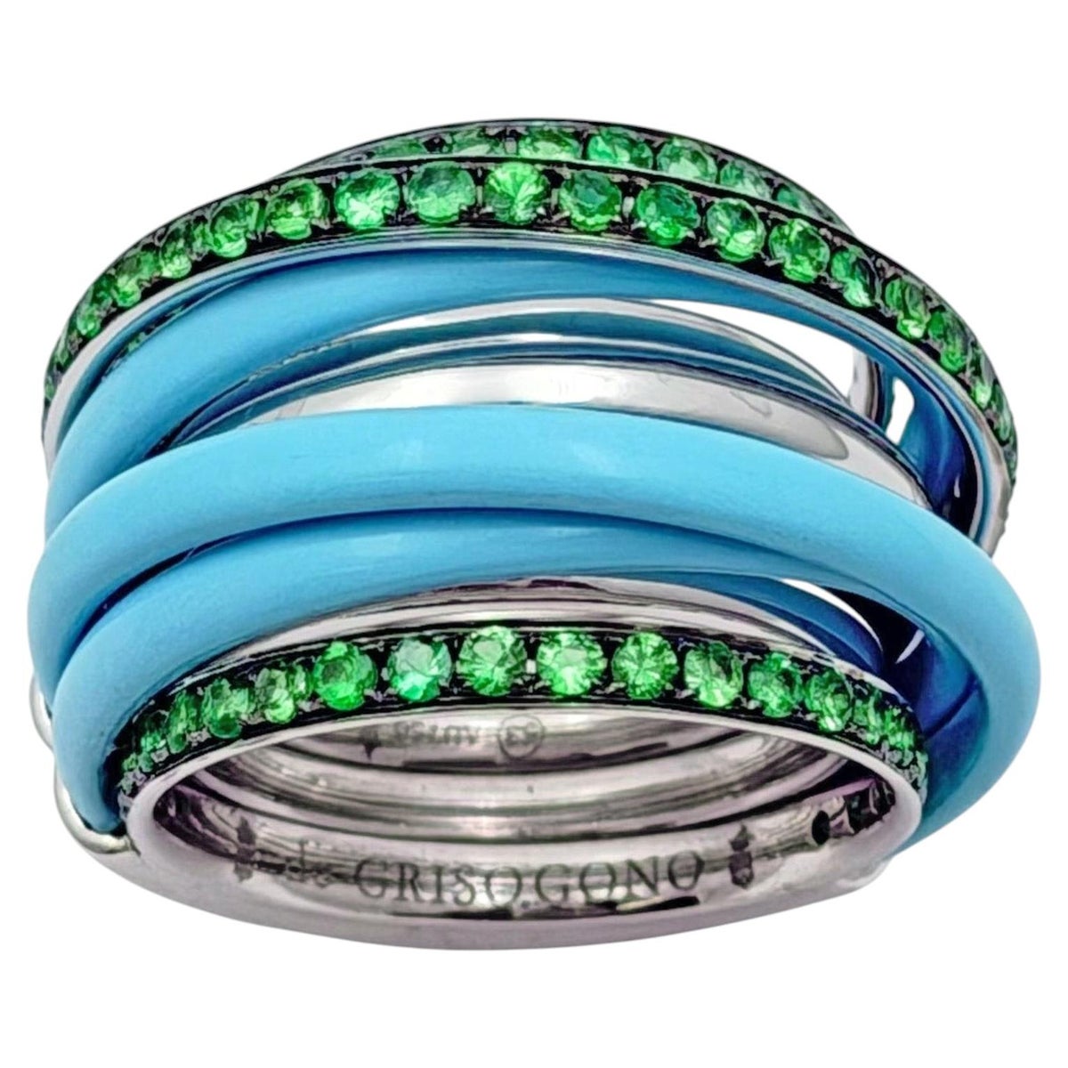 The ring's stacked profile and gem-set edges