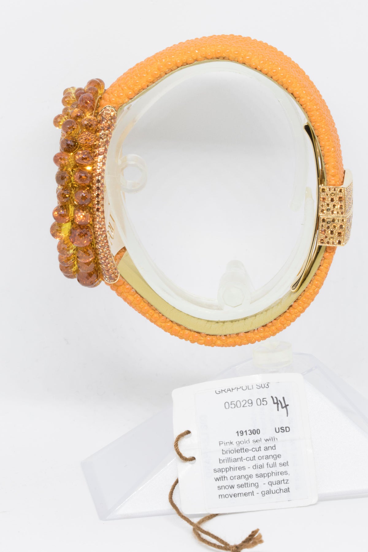 Side view showing the gemstone cluster bezel