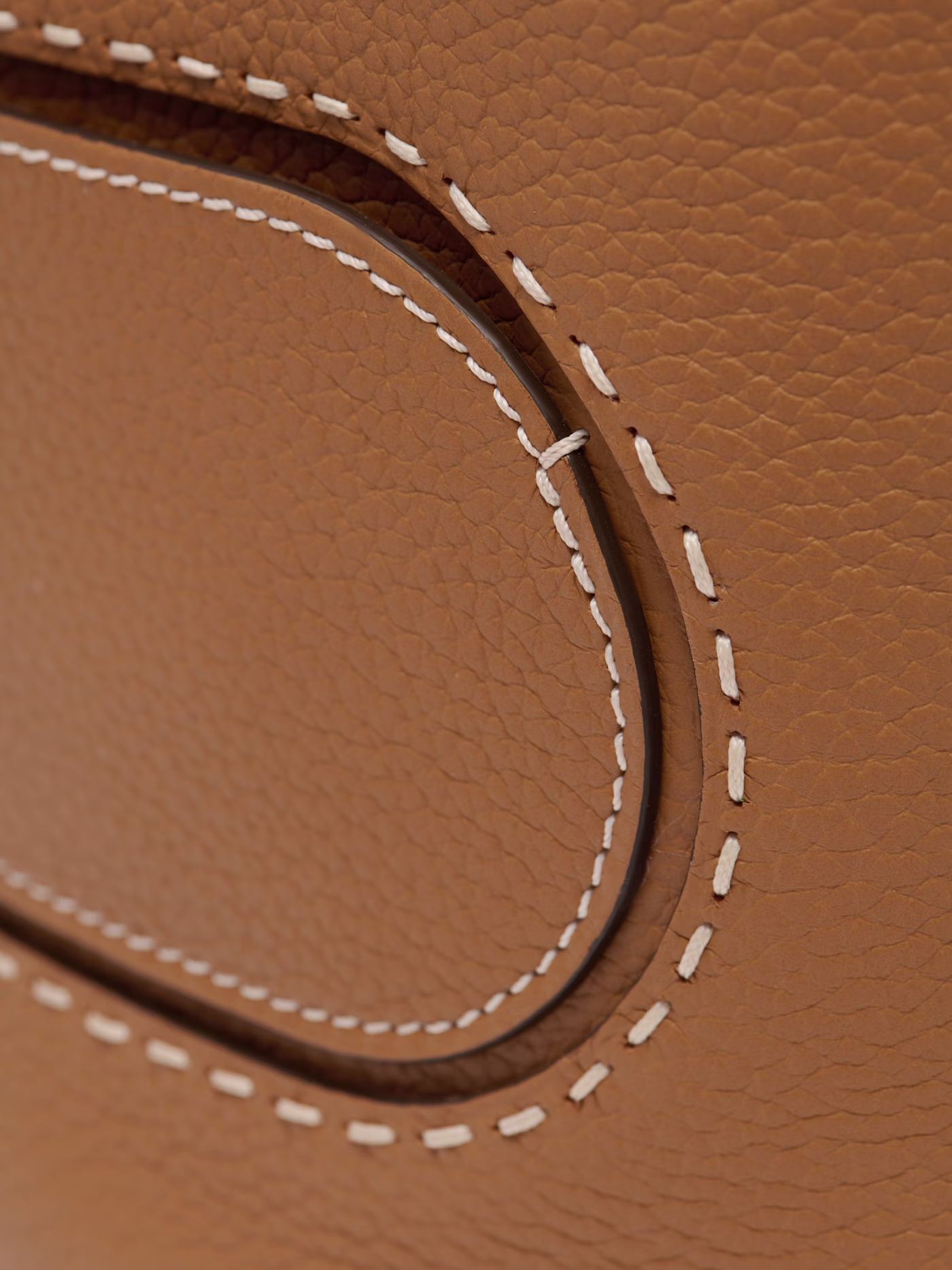 Hand-stitched ivory detailing close-up
