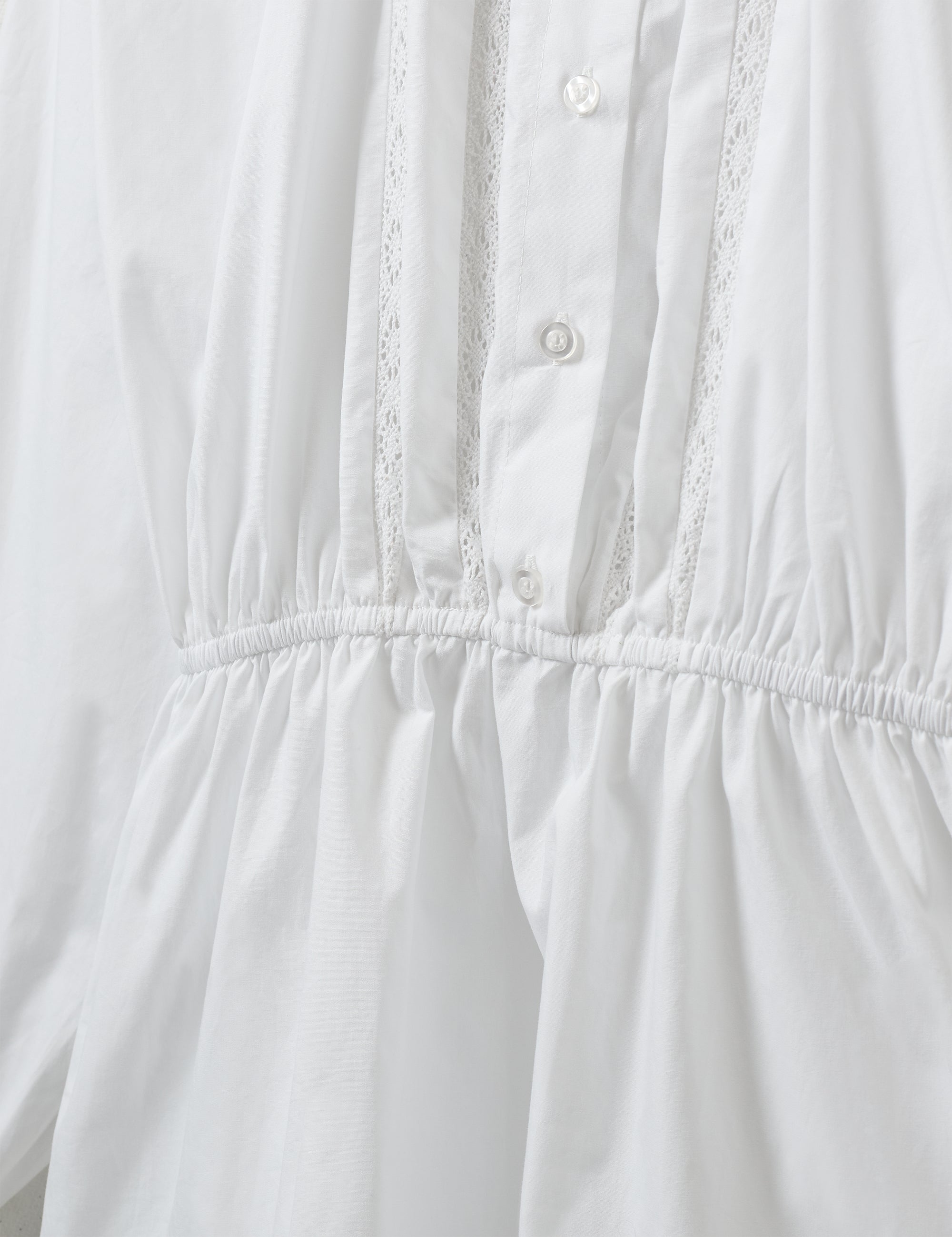 Close-up of lace insert and gathered waist
