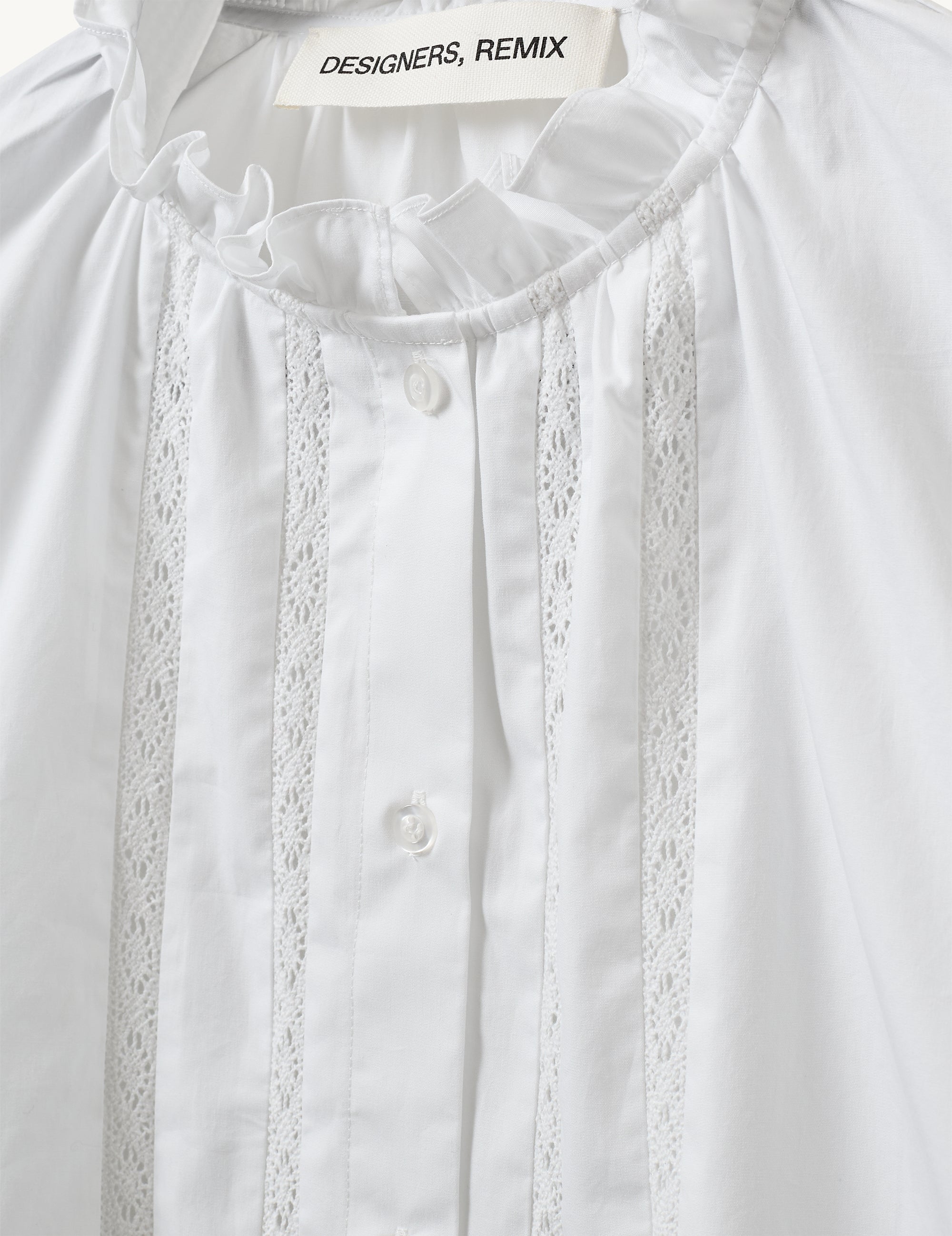 Detail of the high neckline and lace texture