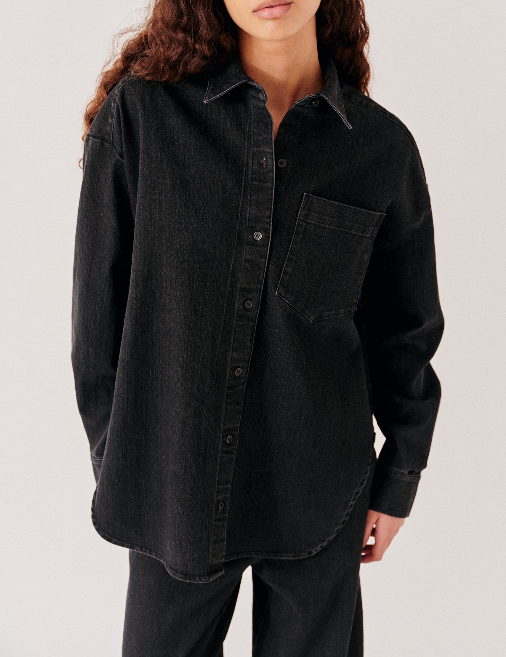 Close view of the black denim shirt front