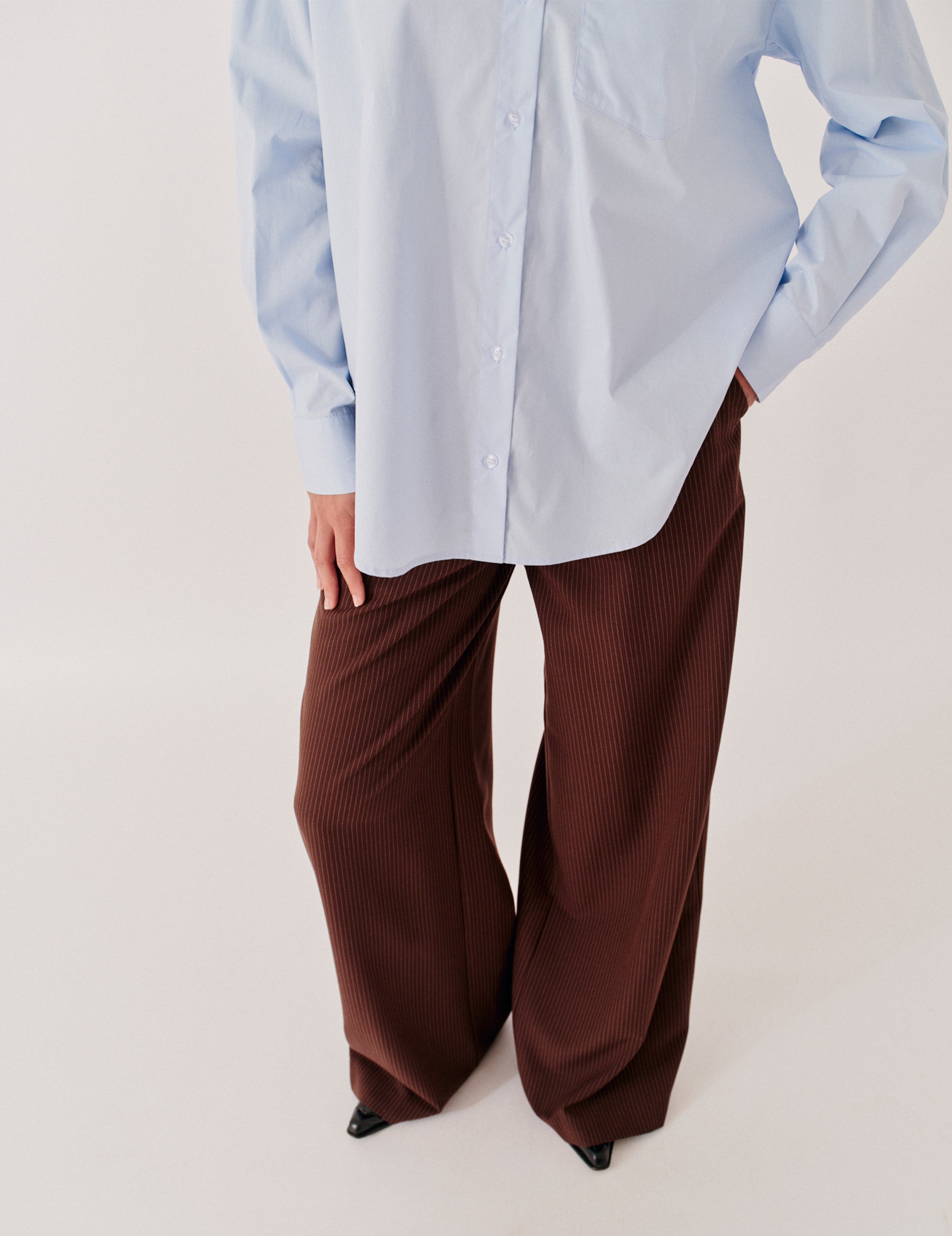 Front studio view with blue shirting