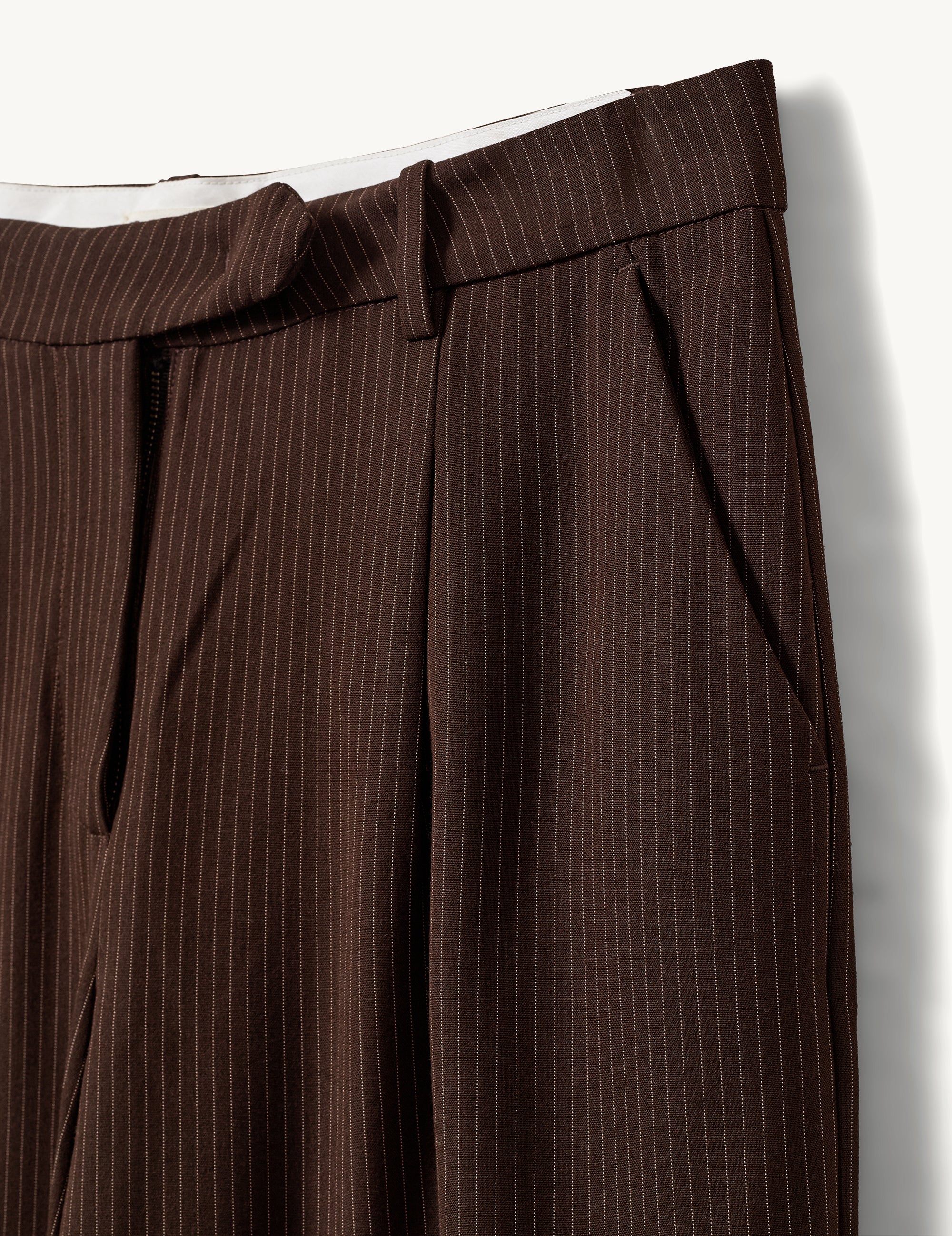 Close-up of pleats and pinstripe fabric
