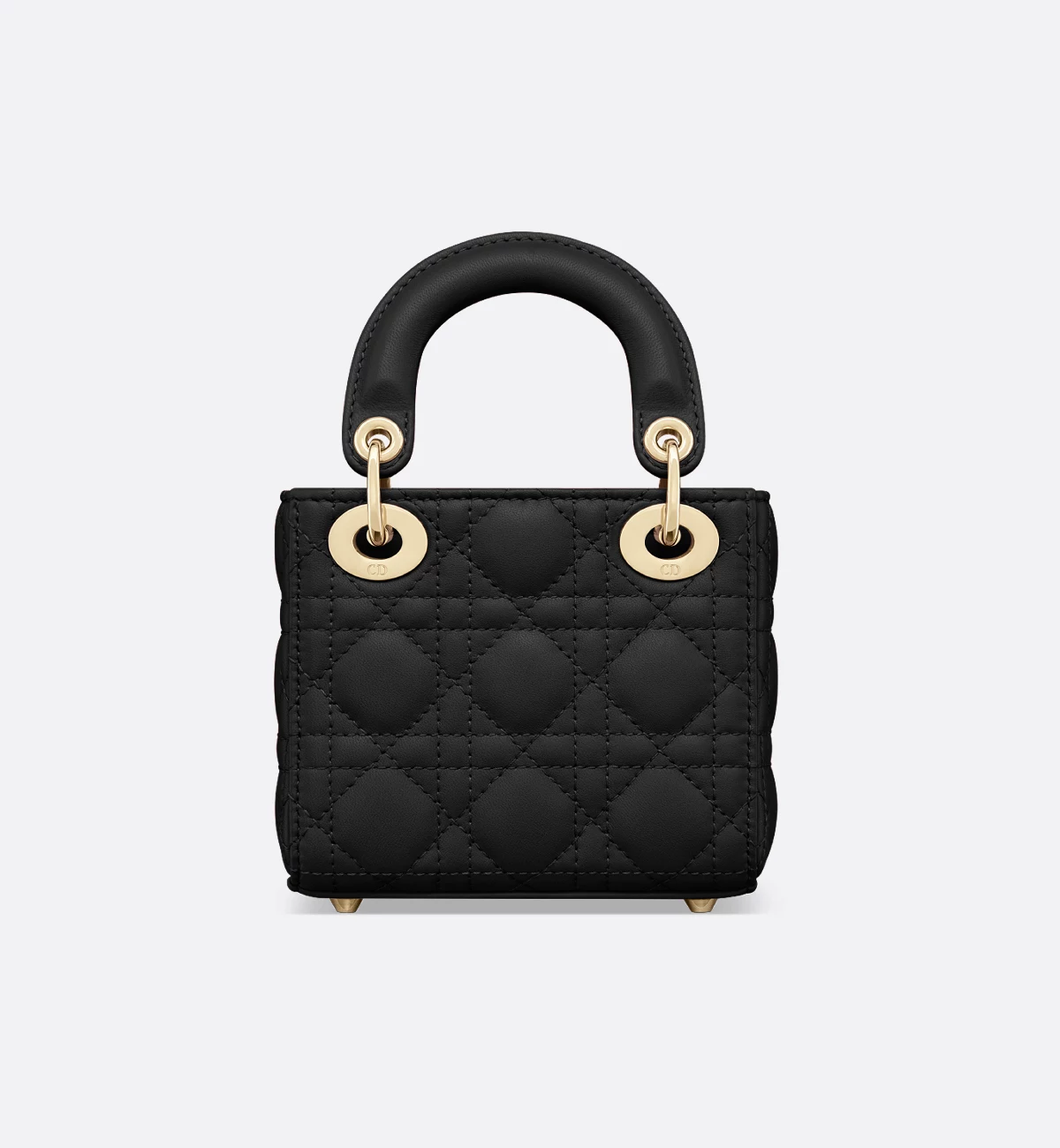 Micro in black lambskin — the smallest carry, on metal feet